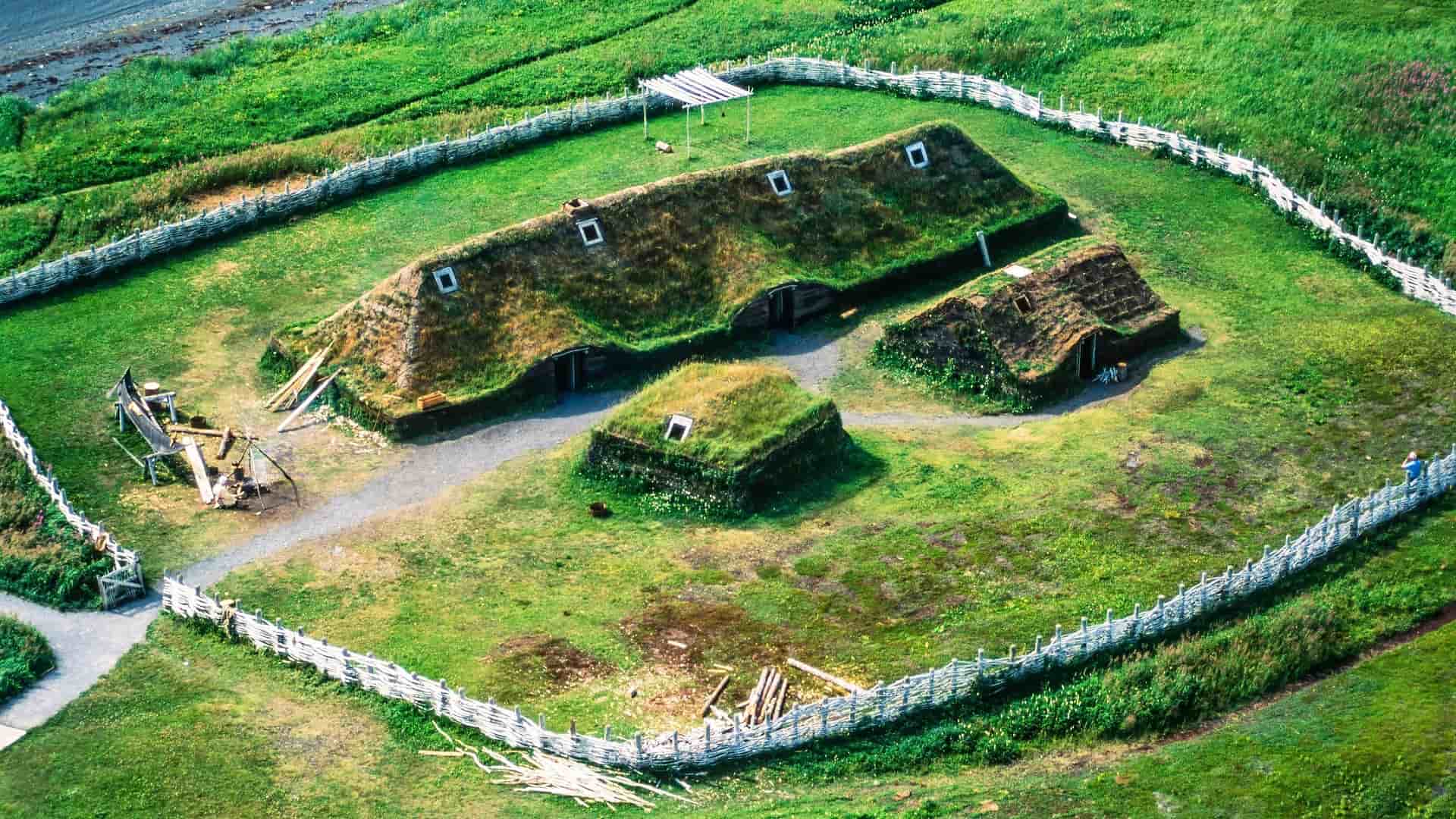 An aerial view of the reconstructed Viking sod houses and longhouses at L'Anse aux Meadows National Historic Site, a UNESCO World Heritage Site in Newfoundland, Canada.