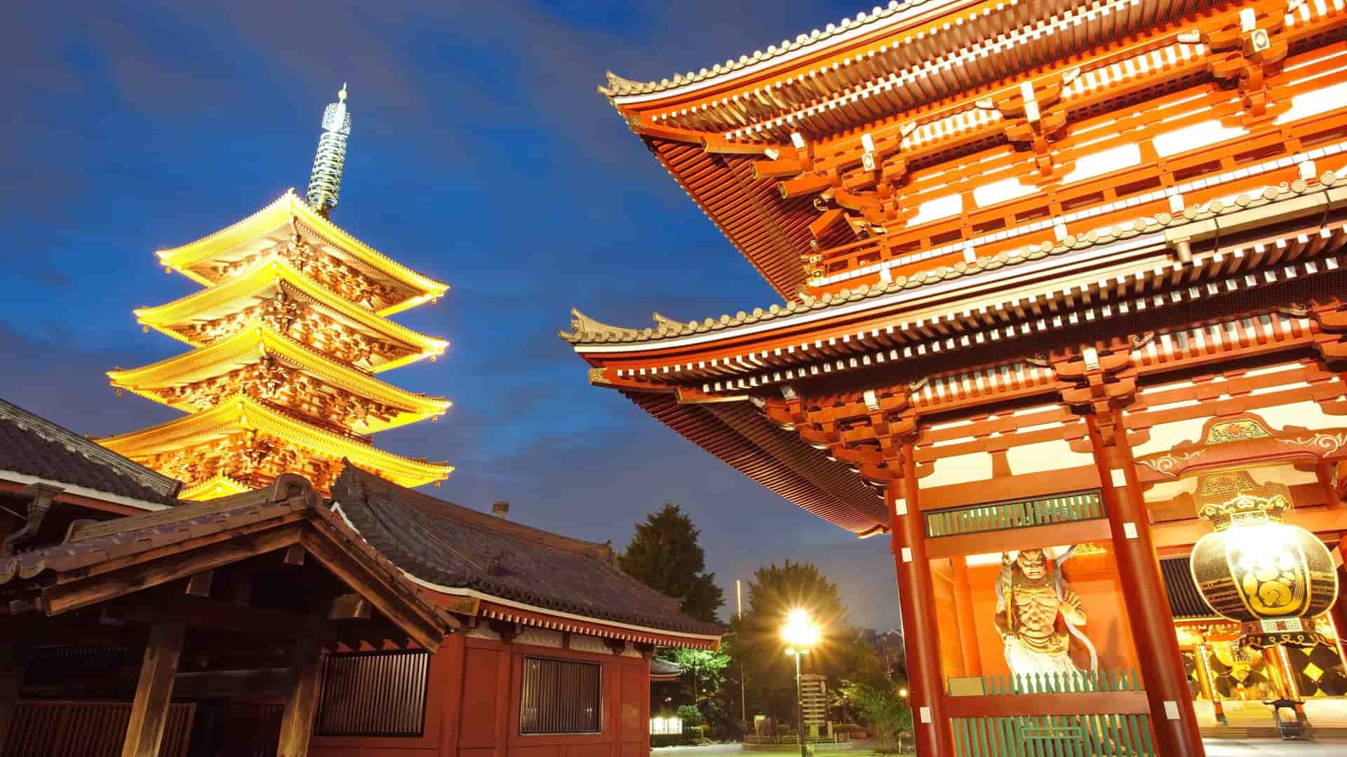 Sensoji Temple and pagoda illuminated at night in Tokyo, Japan.
