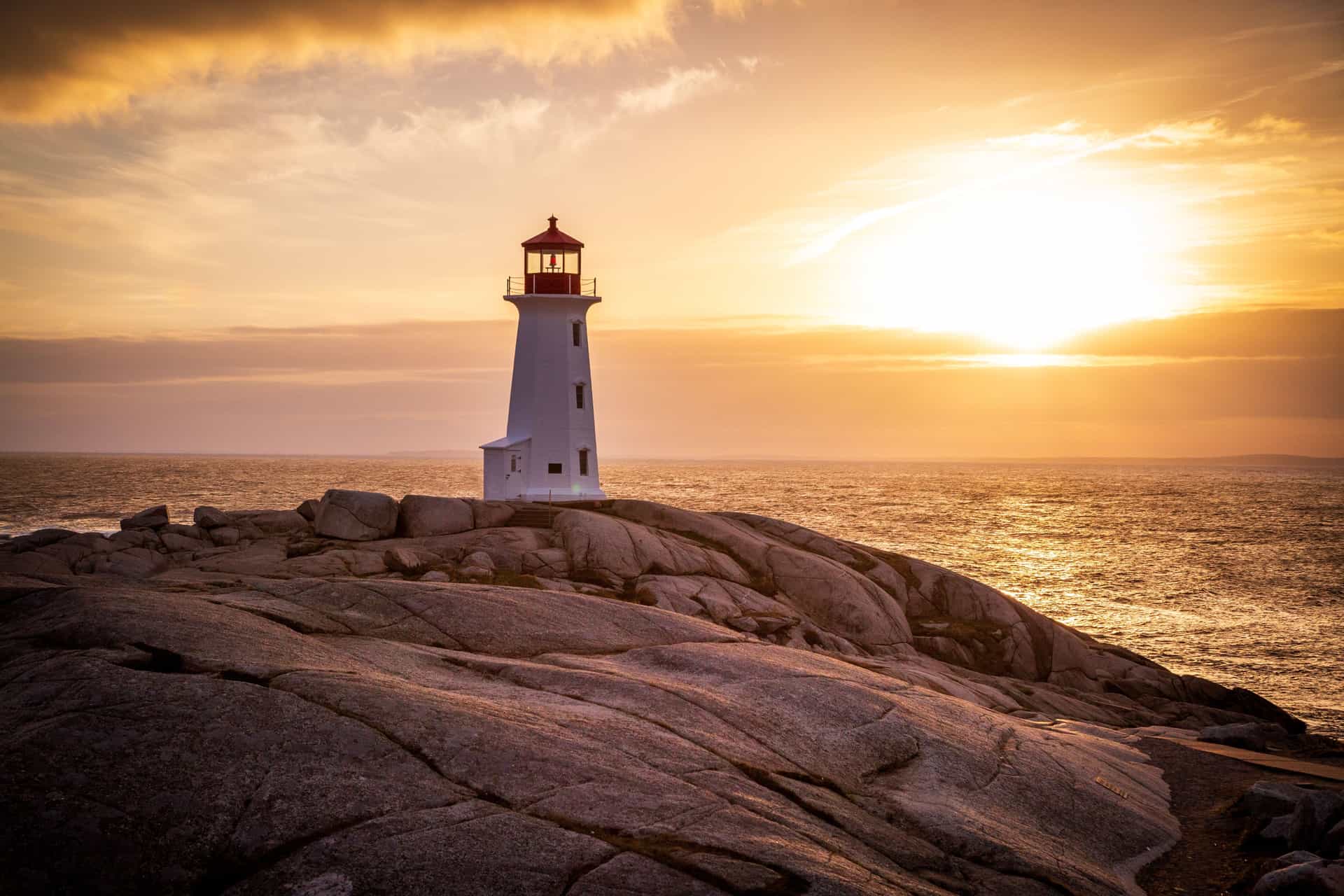 Lighthouse overlooking the Atlantic Ocean in Canada And New England during Sunset.