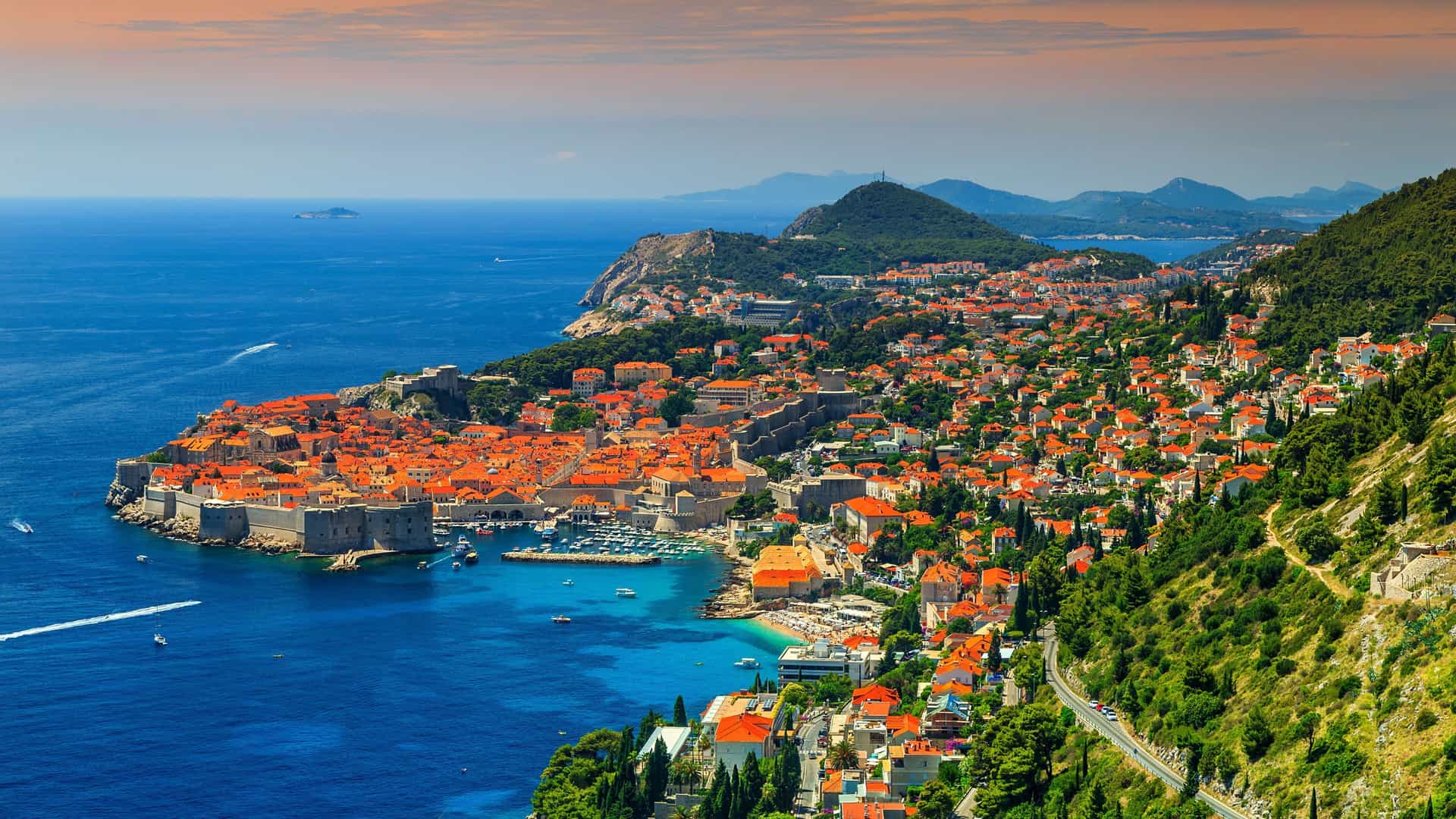 Panoramic view of Dubrovnik Old Town, a stunning Mediterranean destination often featured by Avalon Waterways, with its iconic orange tiled roofs and historic city walls along the Adriatic Sea.