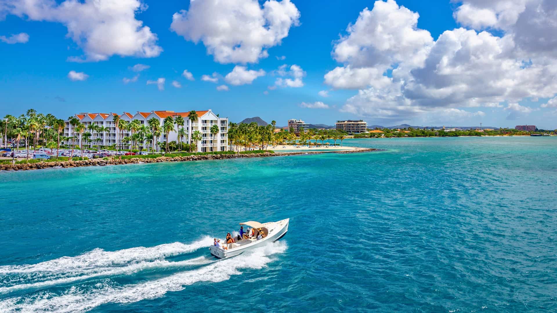 Azamara Cruises: Oranjestad, Aruba - scenic Southern Caribbean, boat, resorts, beaches.