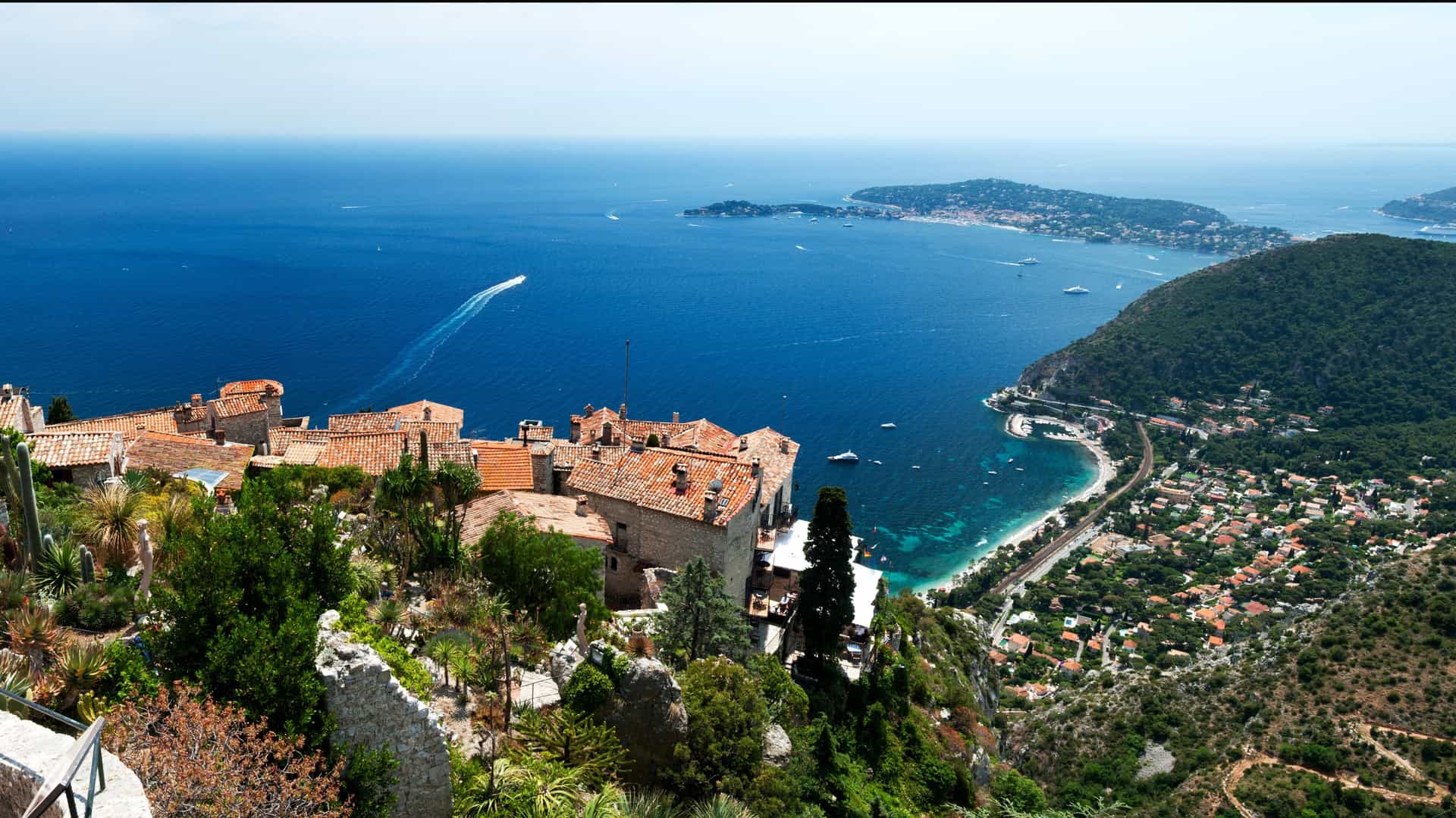 Panoramic view of Eze village overlooking the stunning French Riviera coastline and the Mediterranean Sea, a picturesque port of call on a Carnival European cruise.