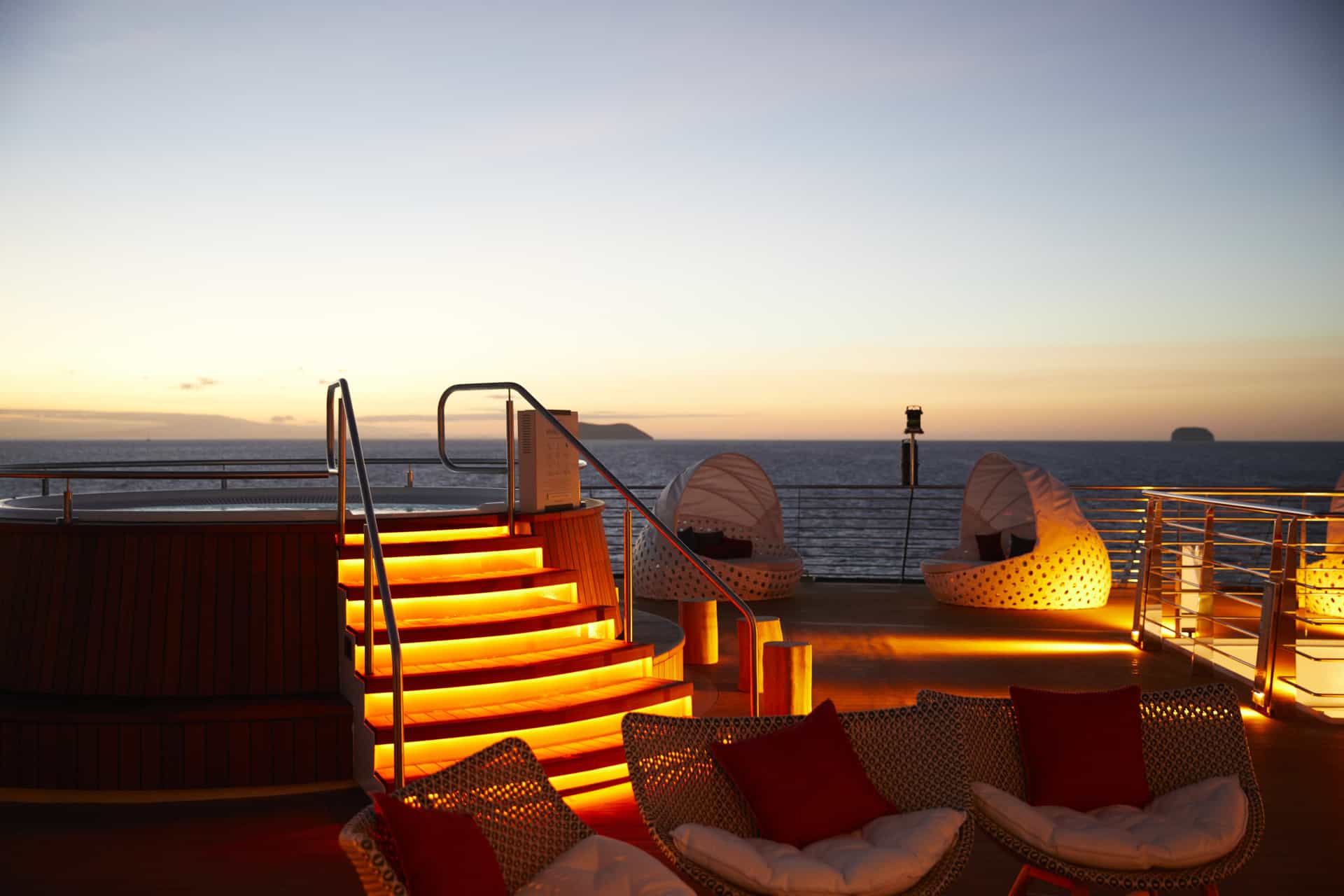 The Vista, on the Celebrity Flora is a chic, open-air lounge and relaxation area with hot tubs, cabanas, and sun loungers, offering South Beach vibes for guests to enjoy cocktails, sunbathing, or stargazing while experiencing the Galapagos Islands on this all-suite mega yacht. 