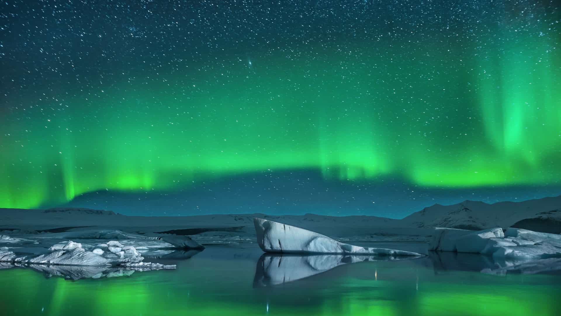 Northern Lights over Iceland's Jökulsárlón glacier lagoon, seen on Cunard Arctic Circle cruises.