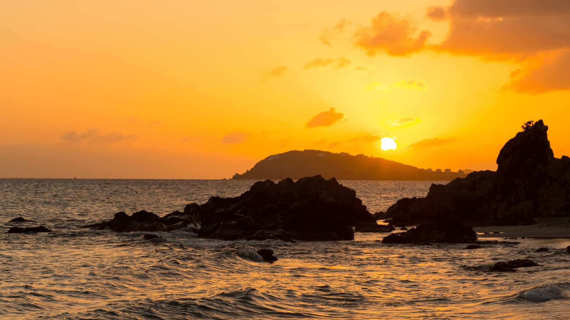 Caribbean sunset in Charlotte Amalie, USVI, a warm Cunard cruise experience.