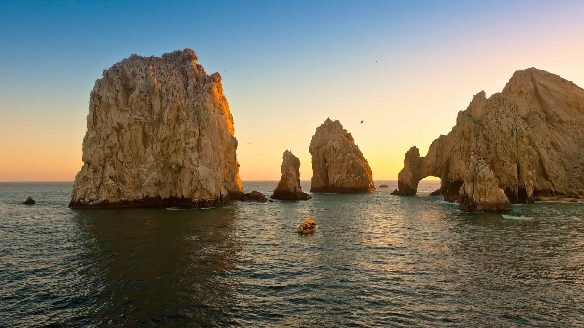 Cabo San Lucas’ iconic El Arco at sunset, a scenic highlight of a Cunard voyage.