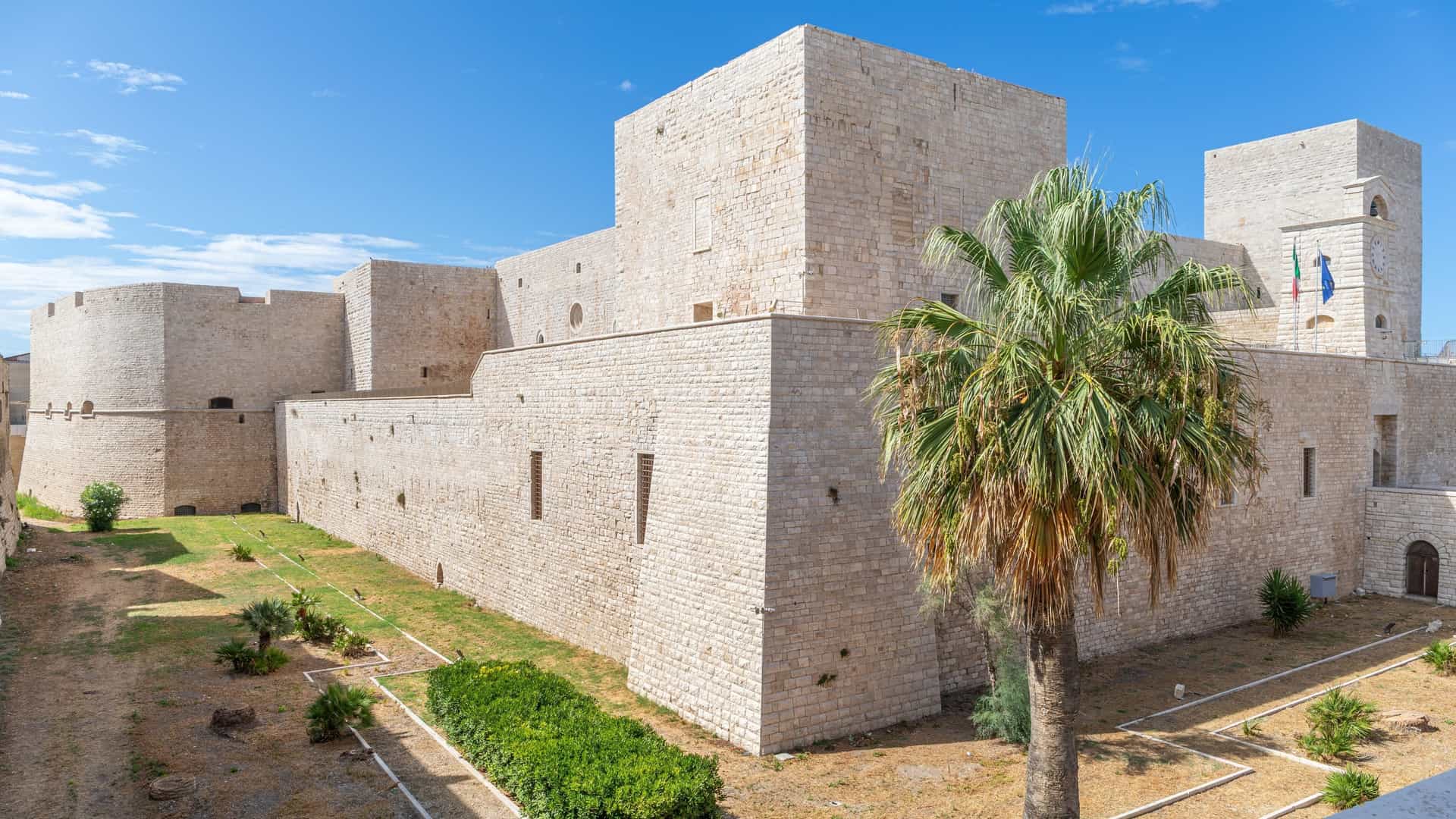 The seaside Castello Svevo di Trani (Swabian Castle) in Puglia, Italy, a medieval fortress situated right on the coast, overlooking the Adriatic Sea.
