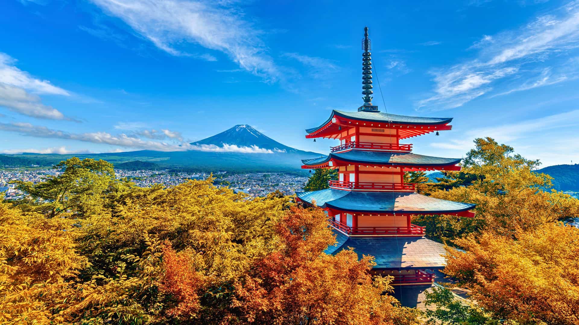Explora journey view of the Chureito Pagoda and Mount Fuji surrounded by autumn foliage in Japan, Asia.