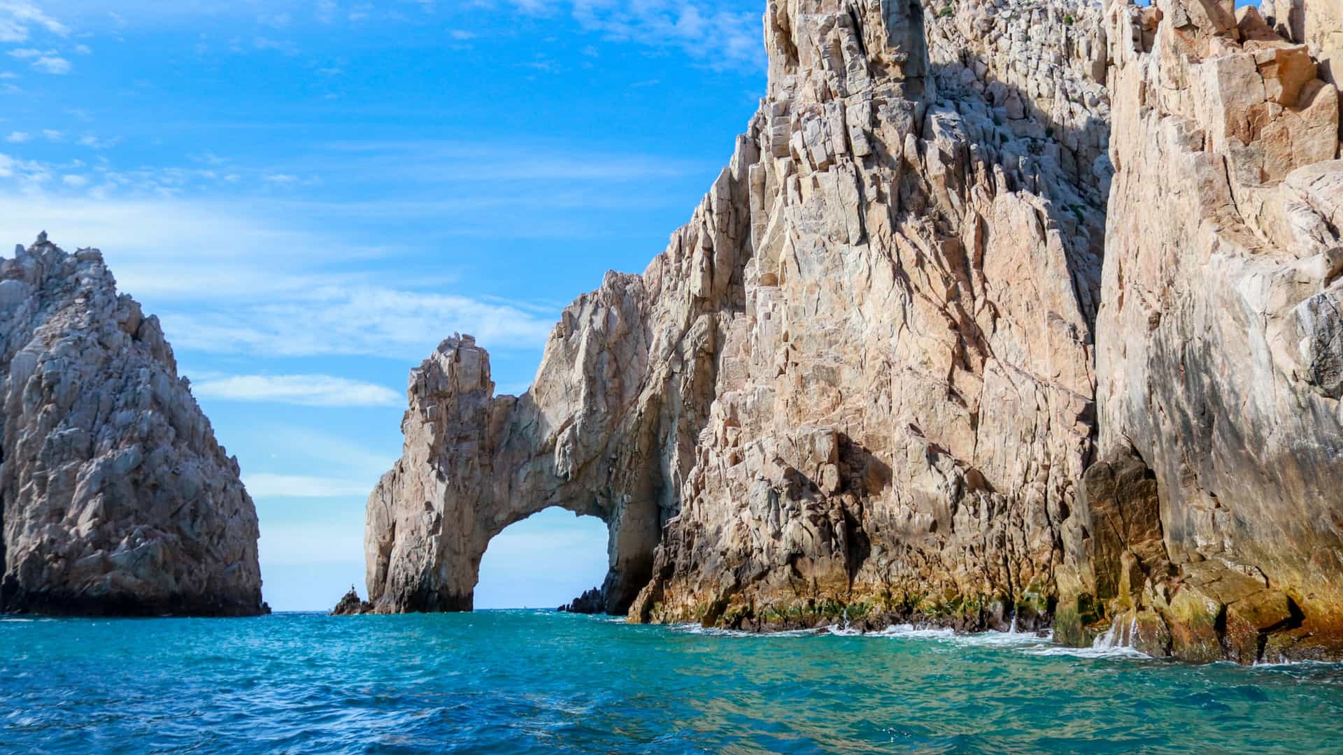 Explora journey view of the iconic rock formation El Arco and turquoise waters in Cabo San Lucas, Mexico.