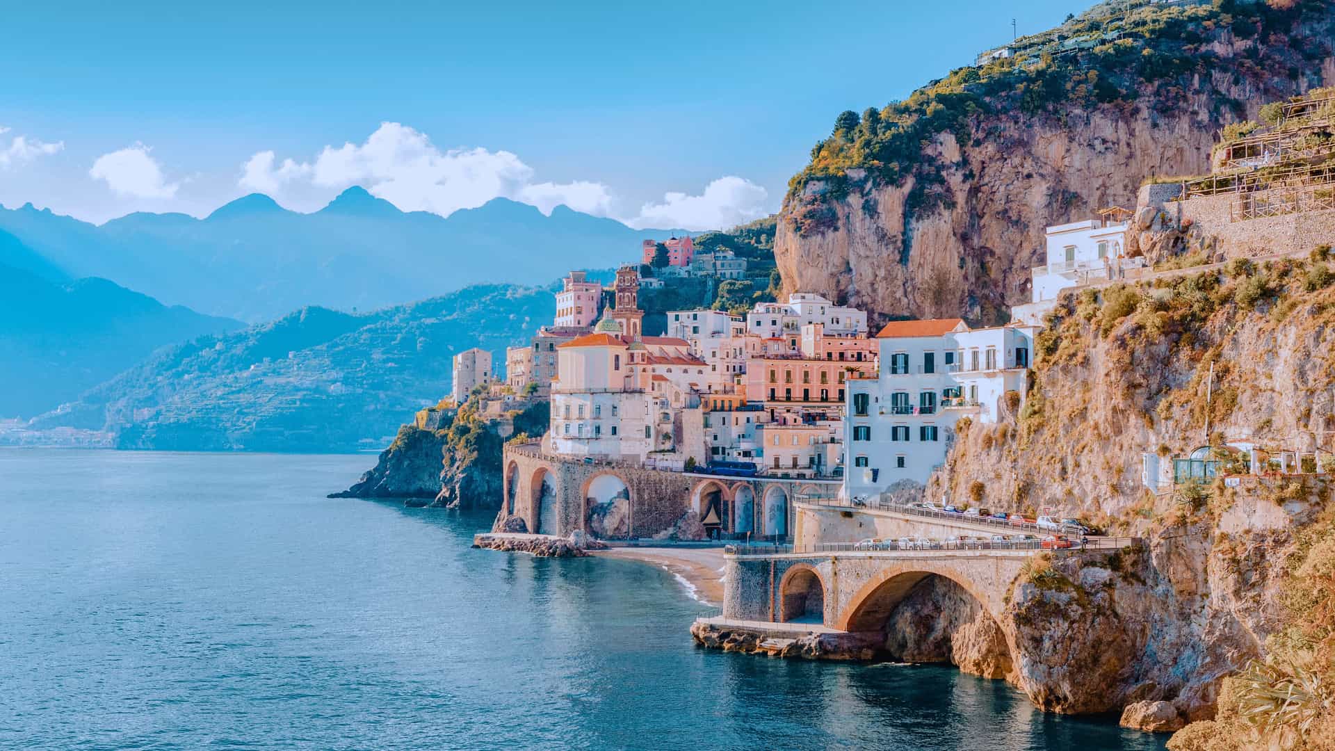 Explora journey view of the Mediterranean coastal town of Atrani along the cliffs of the Amalfi Coast, Italy.