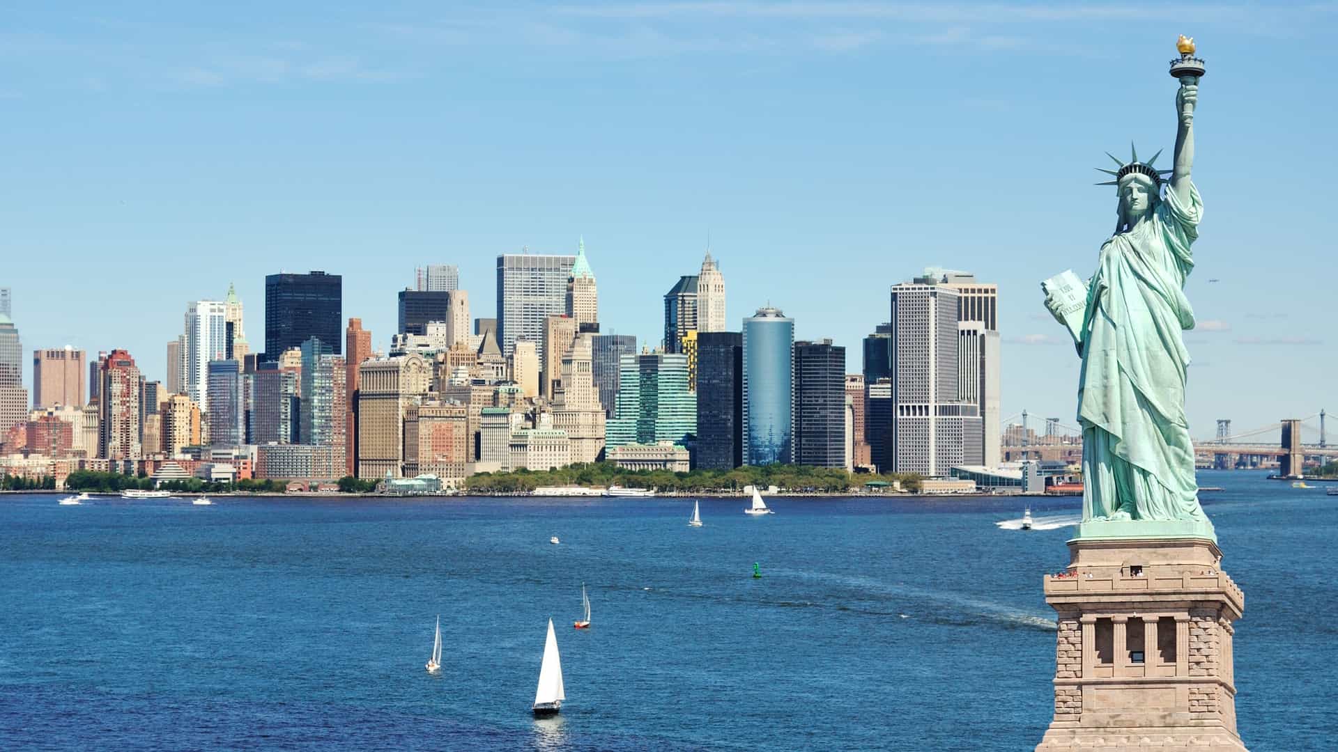 Statue of Liberty with the New York City skyline in Manhattan.