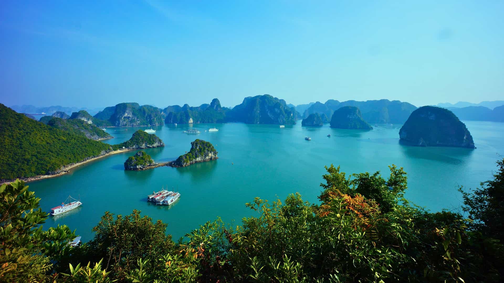 Norwegian Cruise Line ship cruising through the breathtaking limestone karsts of Halong Bay, Vietnam, during an Asia cruise.