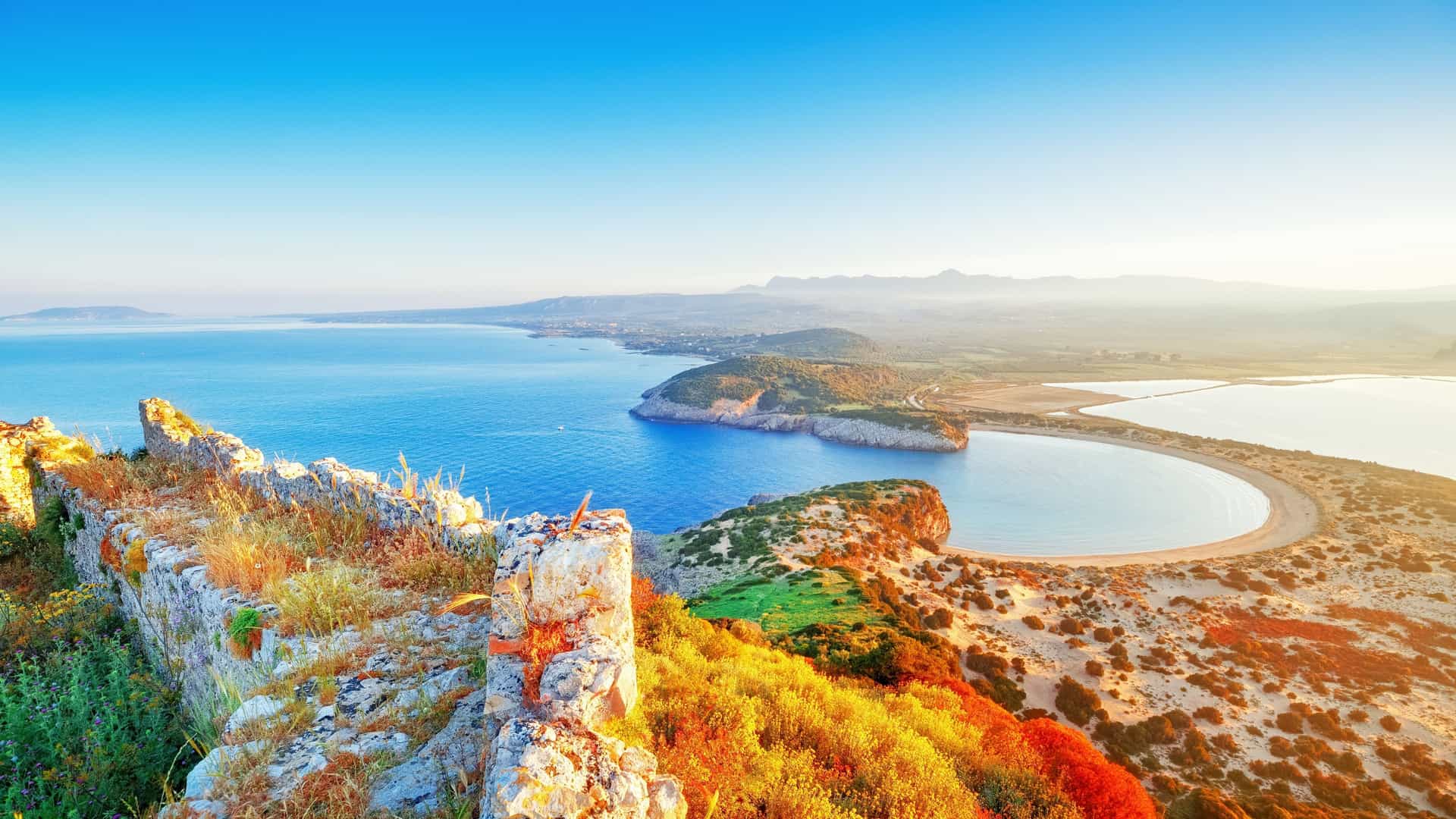 Navarino Coast view from Paleokastro fortress in Pylos, Greece. Shows Voidokilia Beach and the Ionian Sea at sunrise.