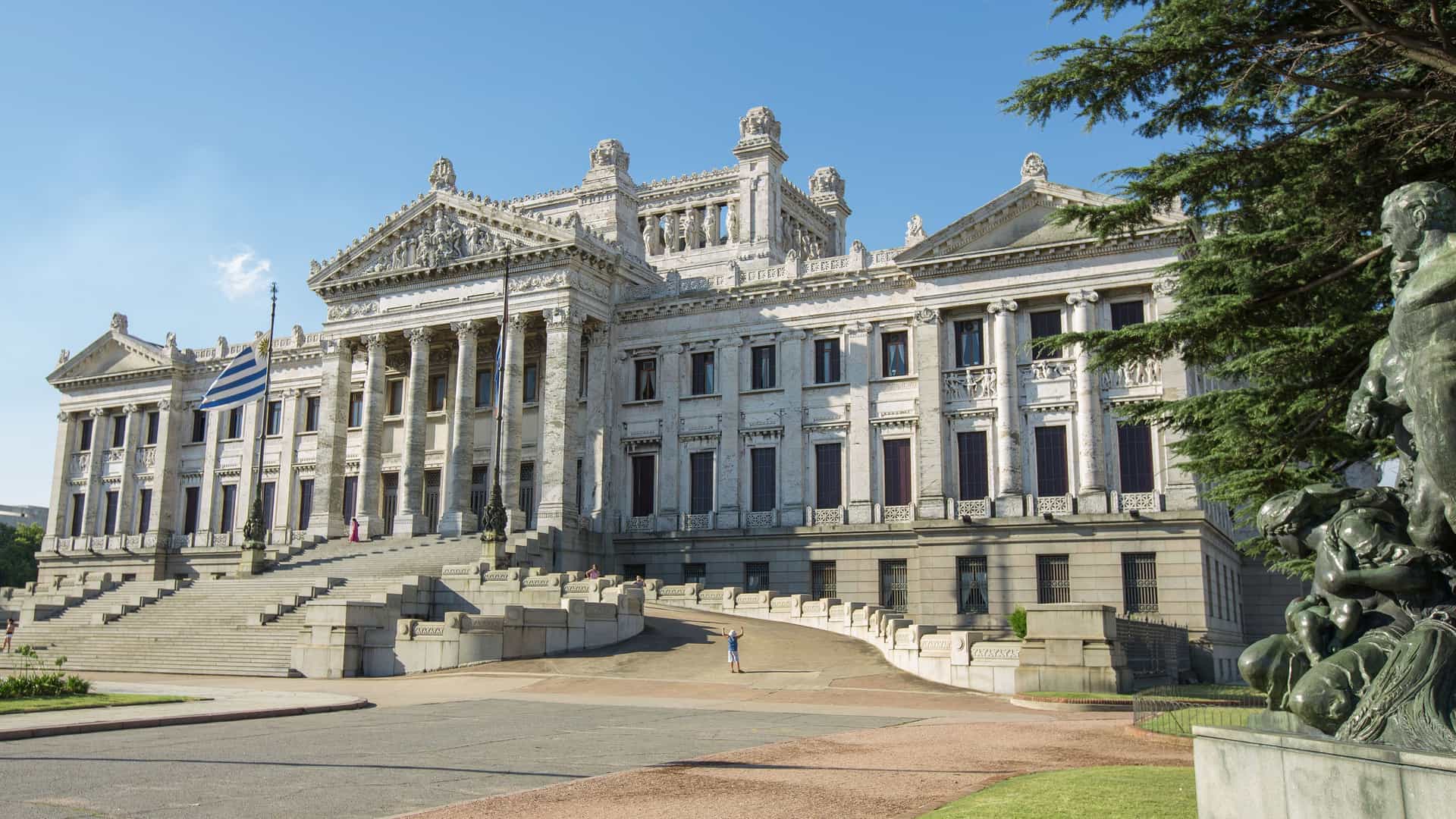 A beautiful frontal shot of the Uruguayan Legislative Palace, or Palacio Legislativo, in Montevideo, with its grand neoclassical architecture, majestic columns, and wide stone staircase.