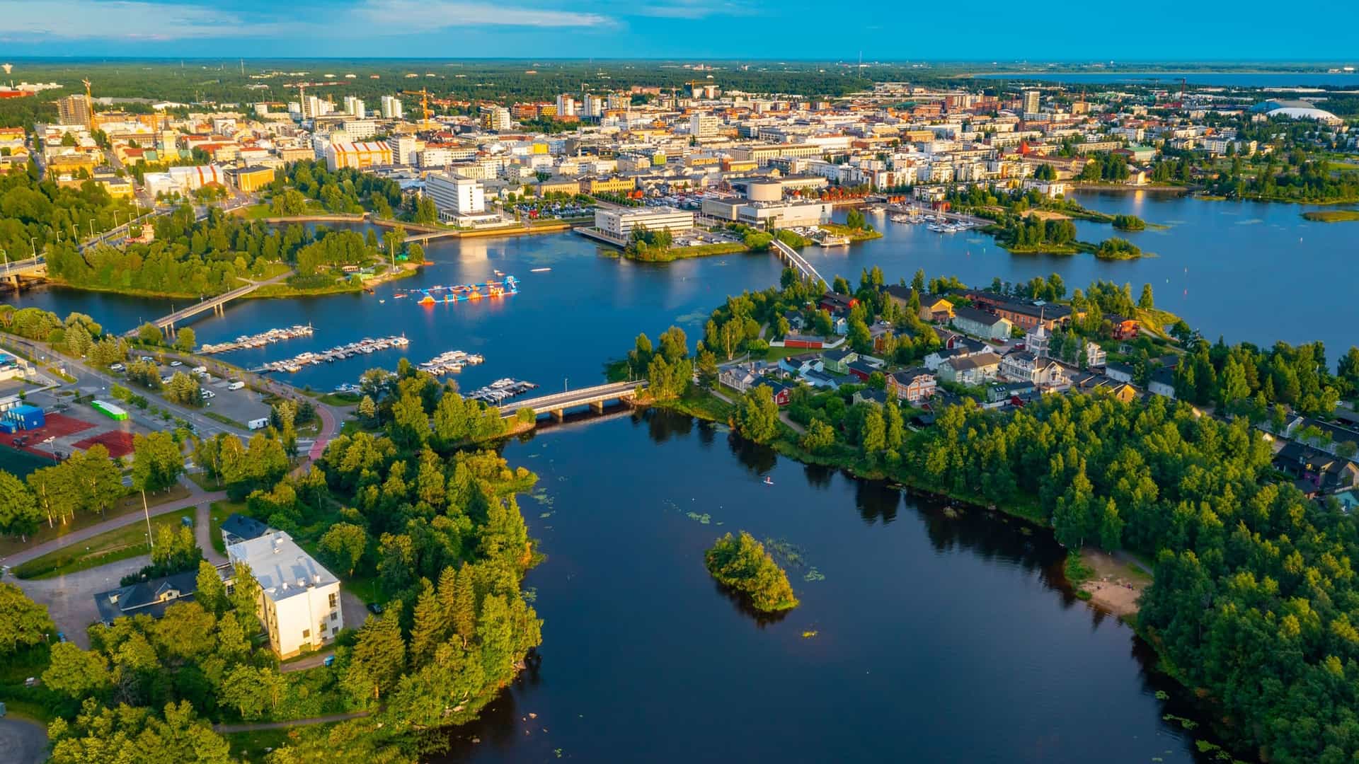 "An aerial panoramic view of the city of Oulu, Finland, with its city center and bridges situated on the banks of the Oulujoki River.  "