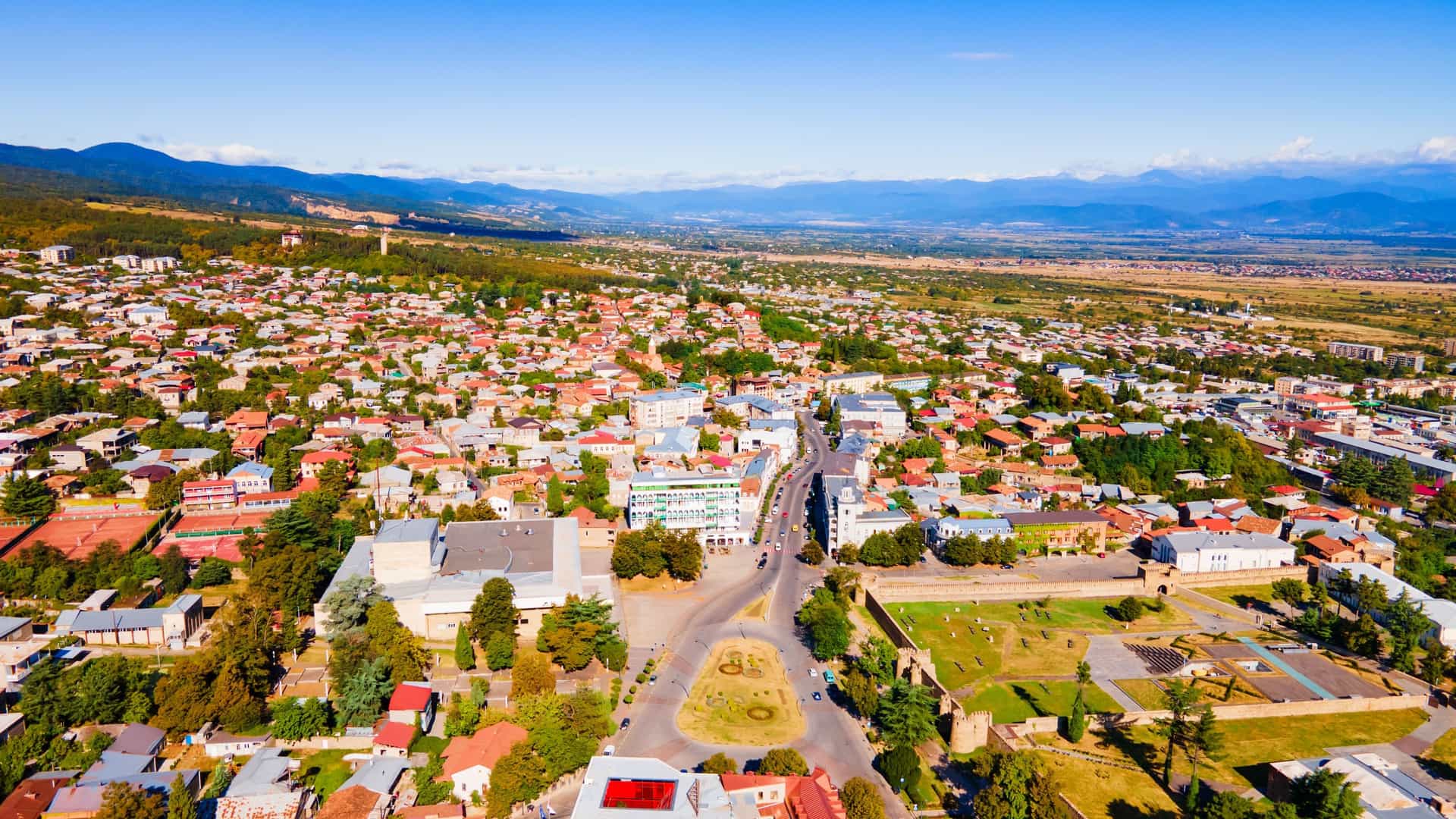 "A beautiful view of the Tel Aviv skyline, showcasing the tall, modern buildings and the bustling sandy beach along the coastline of the Mediterranean Sea at sunset.  "