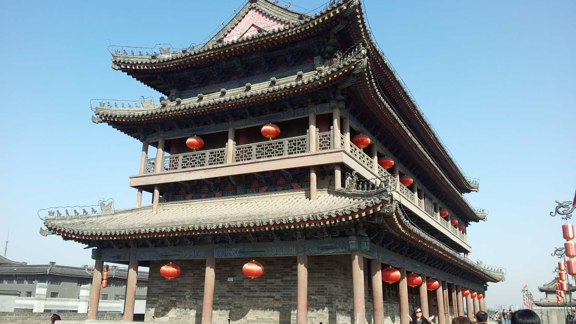  majestic traditional Chinese multi-tiered building with red lanterns in Xiamen, China, representing the rich cultural excursions available on Princess Cruises' Asia voyages.
