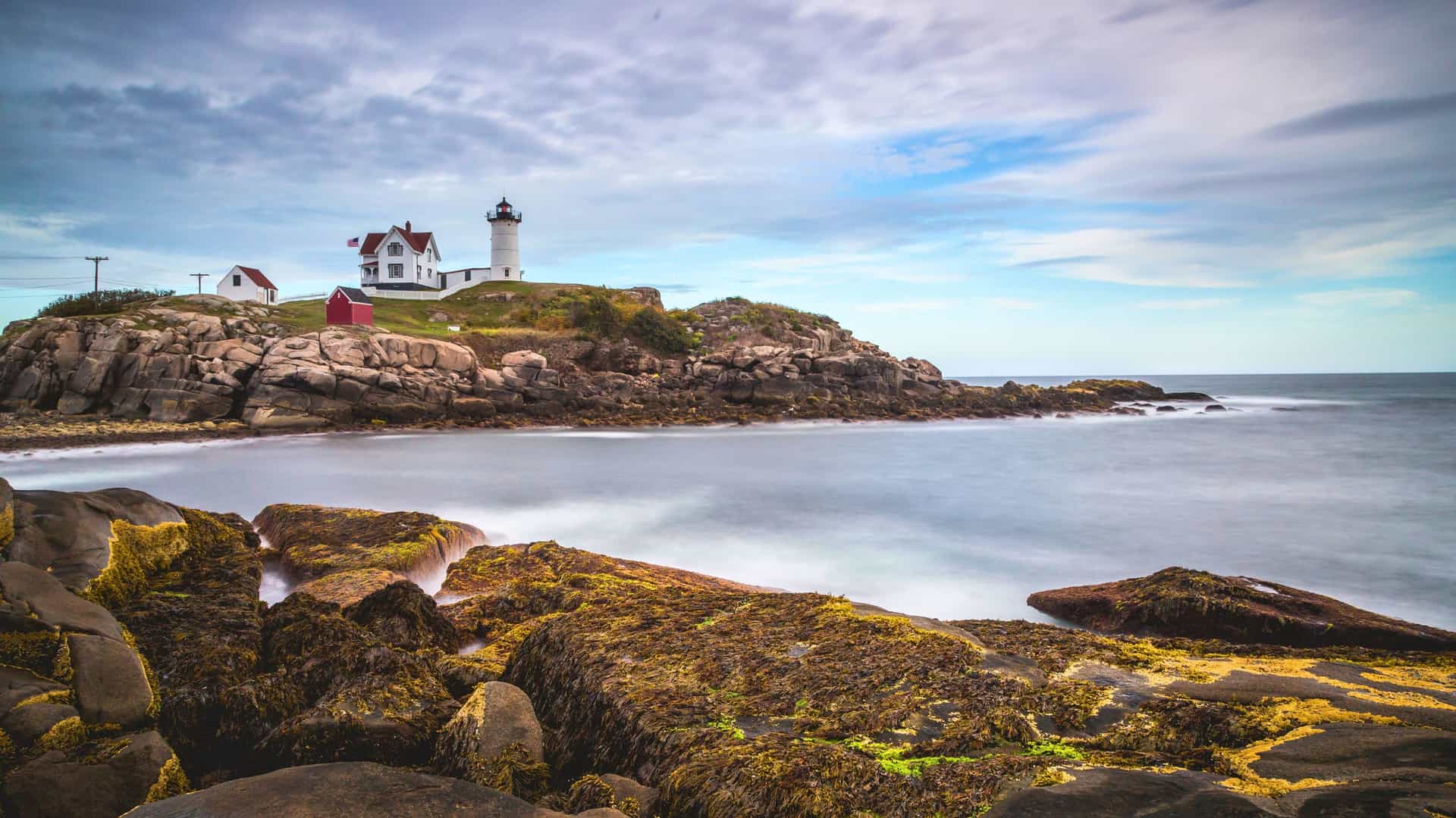 Regent Seven Seas cruise exploring the Canada and New England region, featuring the picturesque Nubble Lighthouse in Maine.