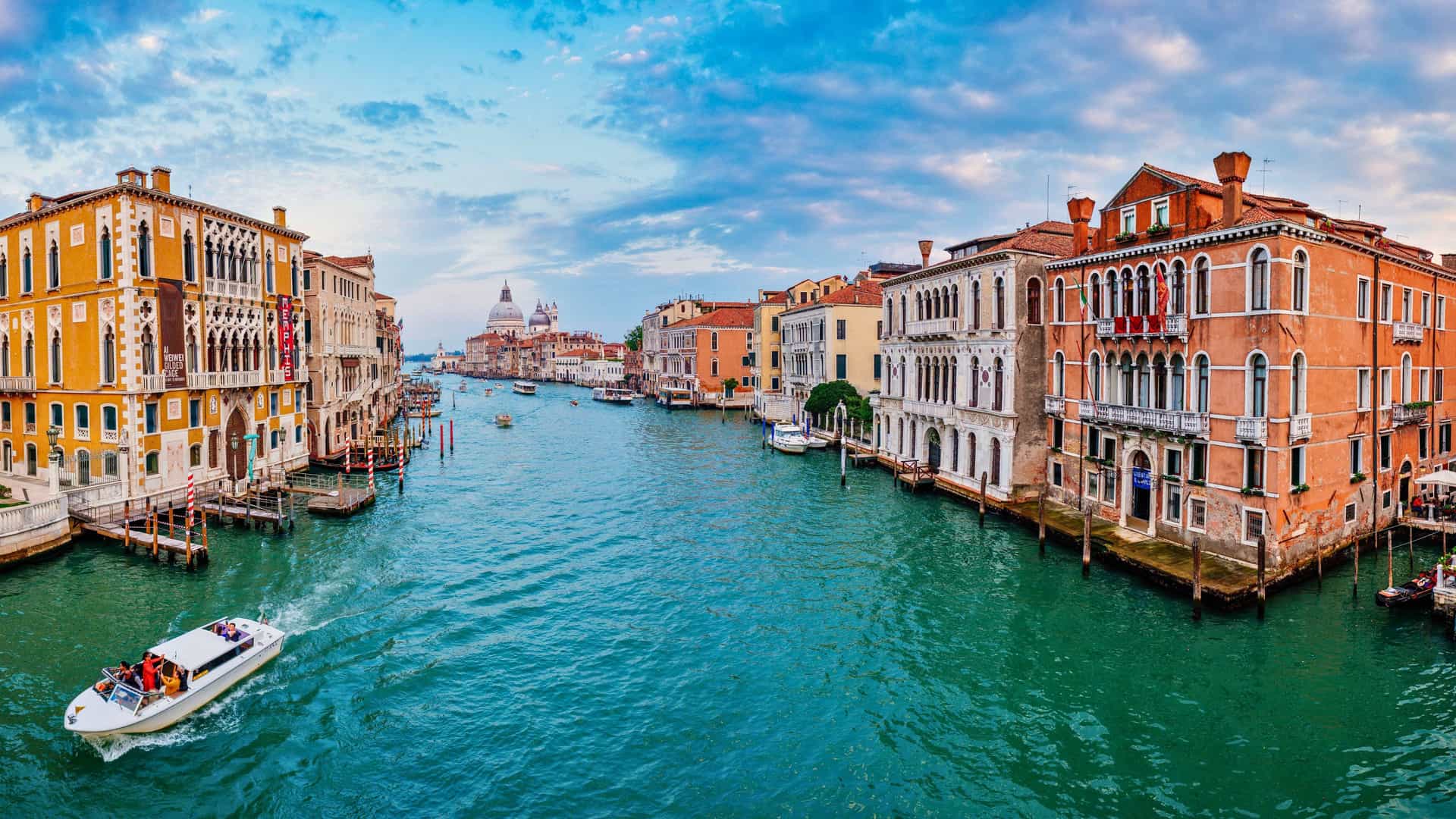Regent Seven Seas cruise view of the famous Grand Canal in Venice, Italy, showcasing historic buildings and boats, ideal for a European cruise itinerary.