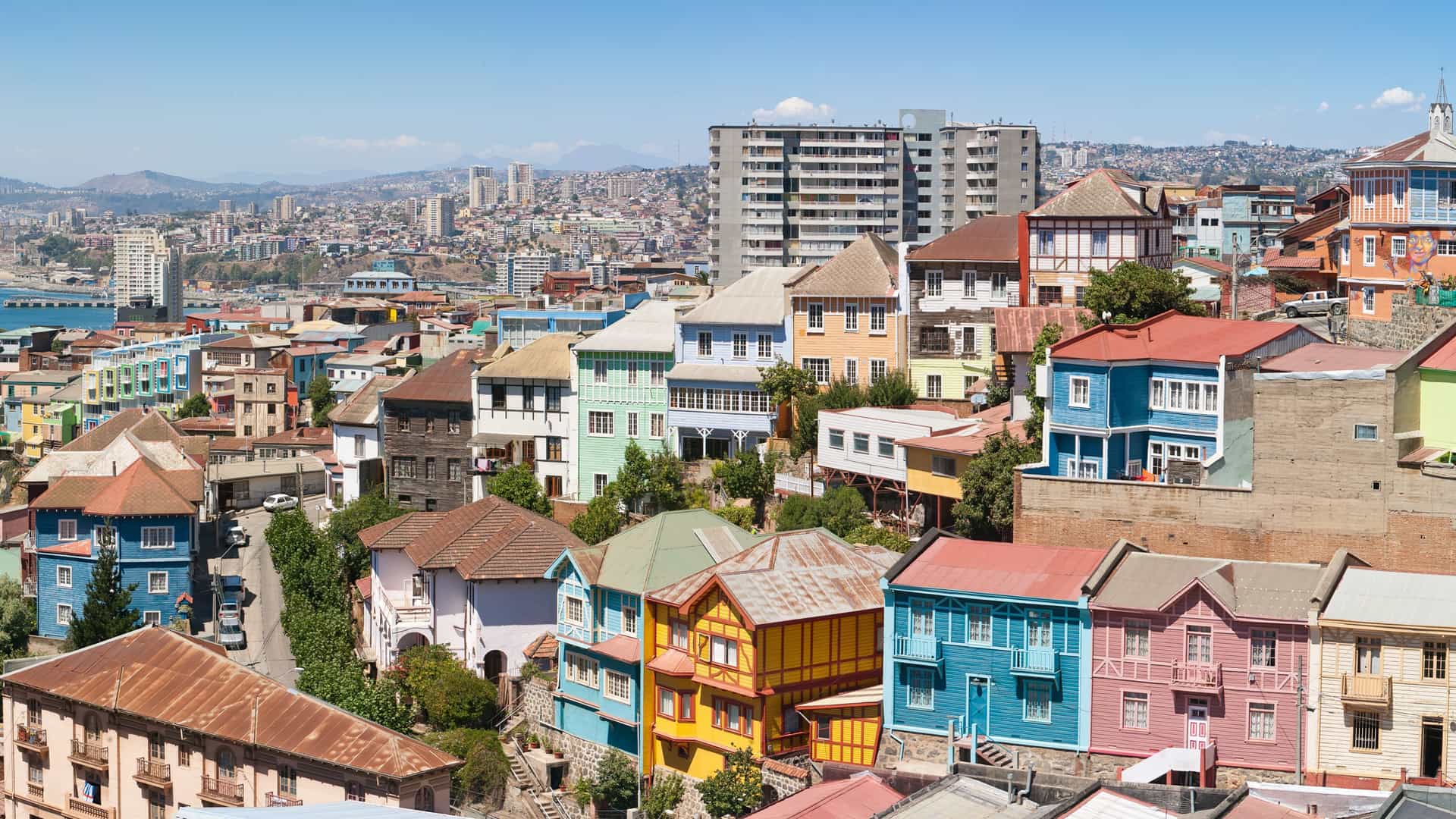 A vibrant panoramic view of the colorful hillside houses in Valparaíso, South America (Chile), a cultural port city visited on Silversea cruises.