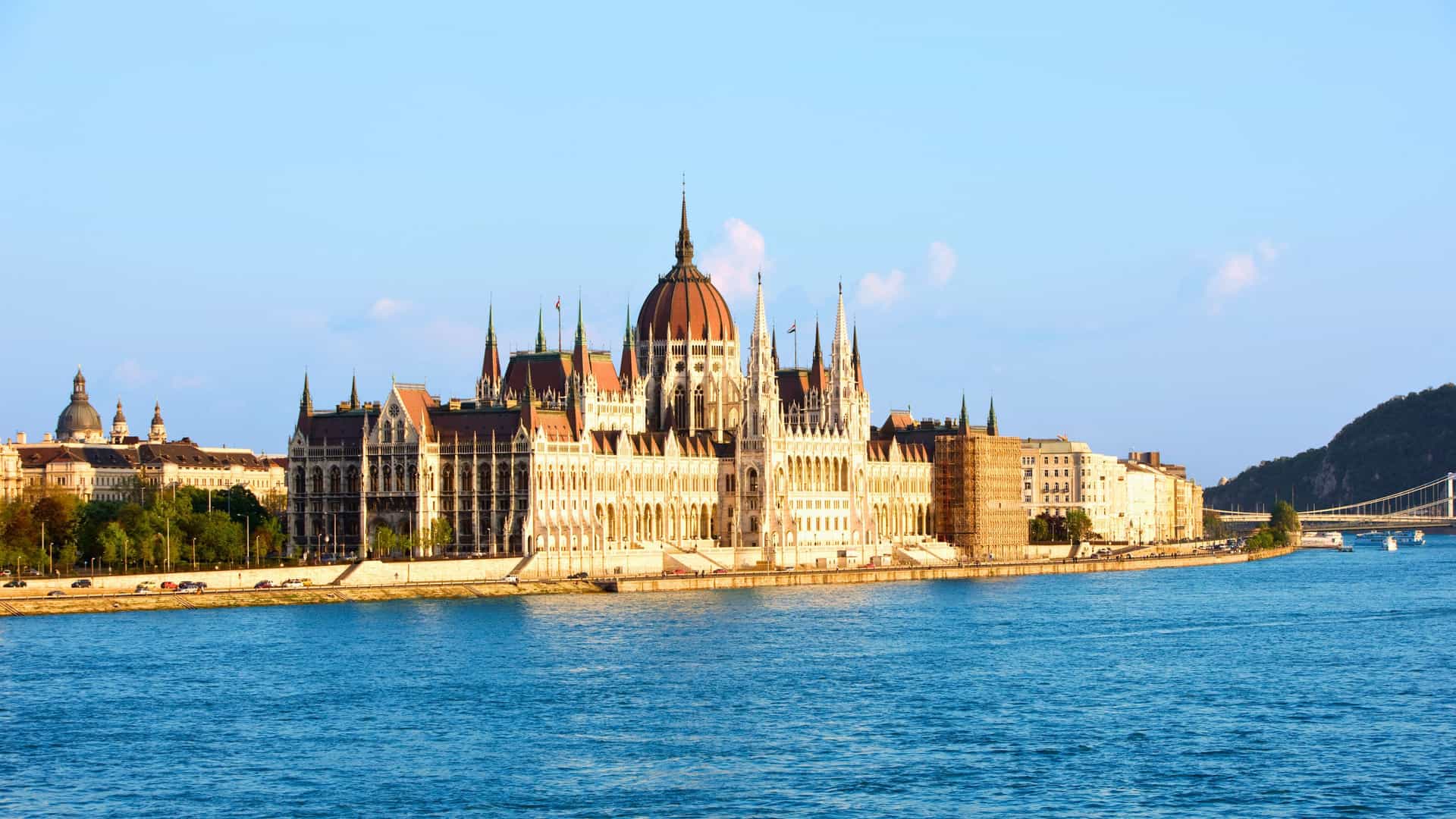 The Hungarian Parliament Building in Budapest, Hungary, seen from a Uniworld river cruise on the Danube River, showcasing the city's historic architecture in Europe.