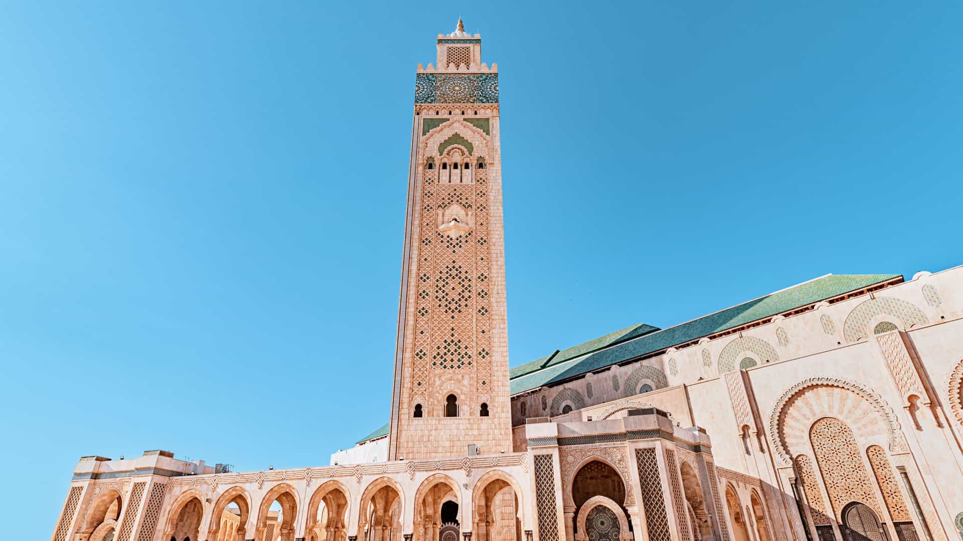 A beautiful exterior shot of the Hassan II Mosque in Casablanca, Morocco, a popular African destination on Viking Ocean Cruises.