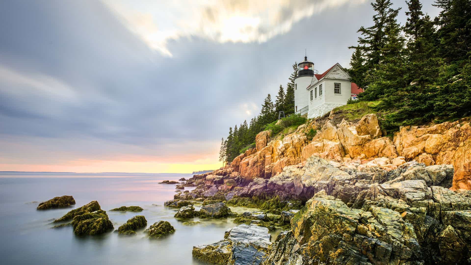 The iconic Bass Harbor Head Lighthouse on the rocky coast of Maine, a scenic stop on a Viking Ocean cruise to Canada and New England.