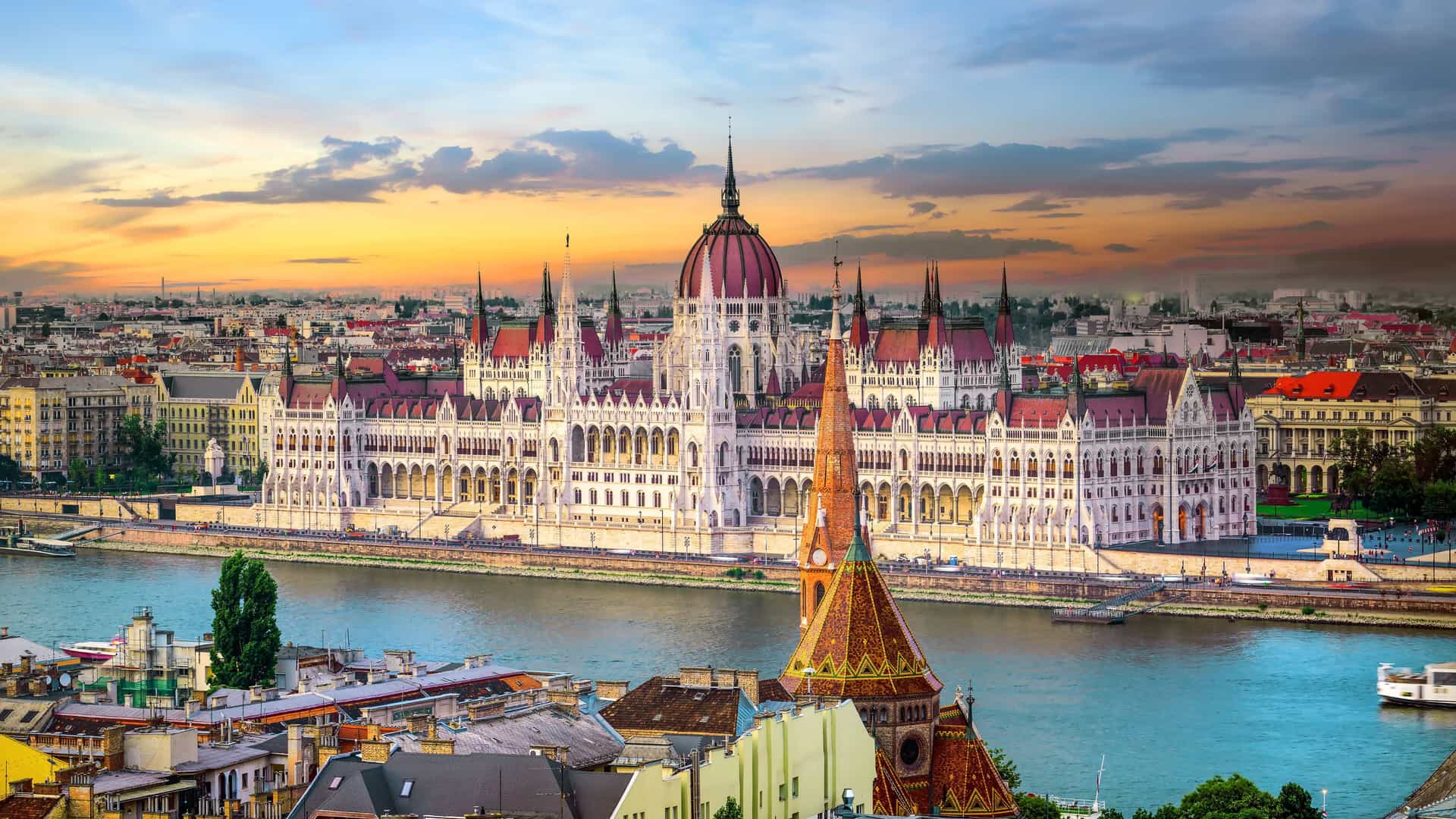 The magnificent Hungarian Parliament Building on the banks of the Danube River in Budapest, a stunning view and a highlight of a Viking European River cruise.