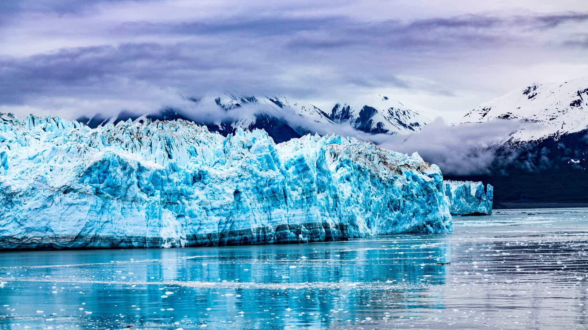 Massive glacier in Alaska with mountains, a scenic view on a Windstar cruise.