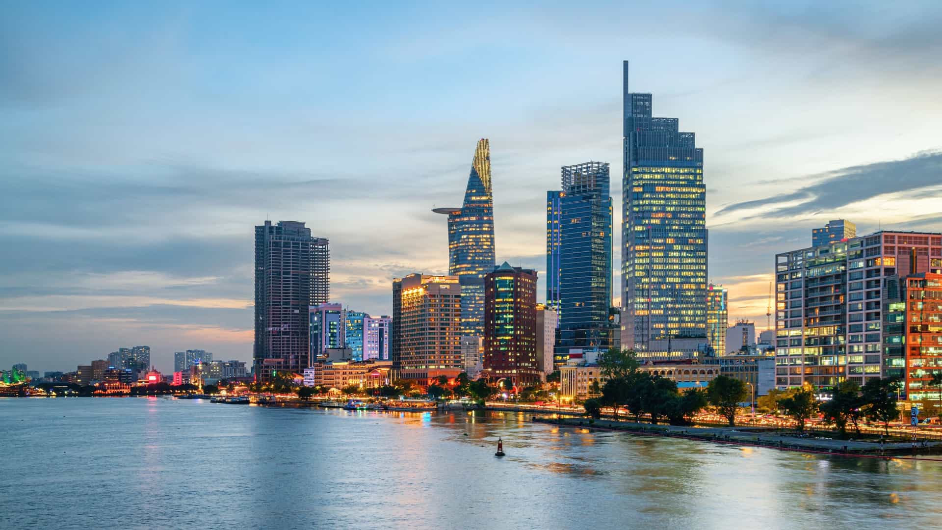 Ho Chi Minh City skyline at sunset along the Saigon River in Asia, Vietnam, a Windstar cruise port of call.