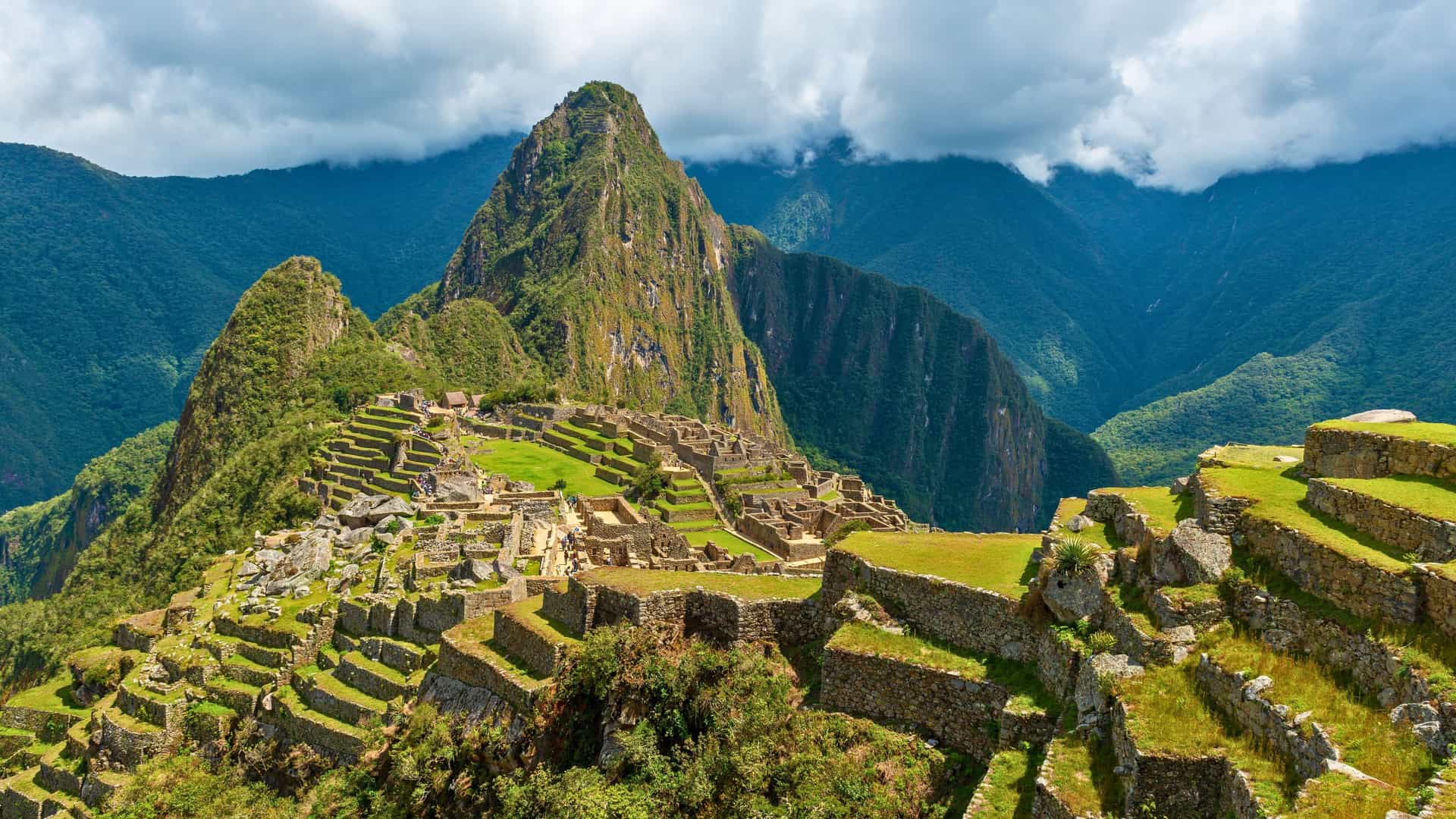 Historic stone ruins of Machu Picchu, Peru, nestled high in the Andes mountains, an iconic destination on a Windstar cruise in South America.
