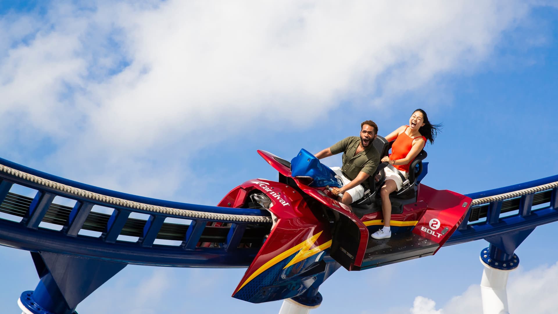 2 people riding BOLT, Carnival's roller coaster, onboard Mardi Gras.