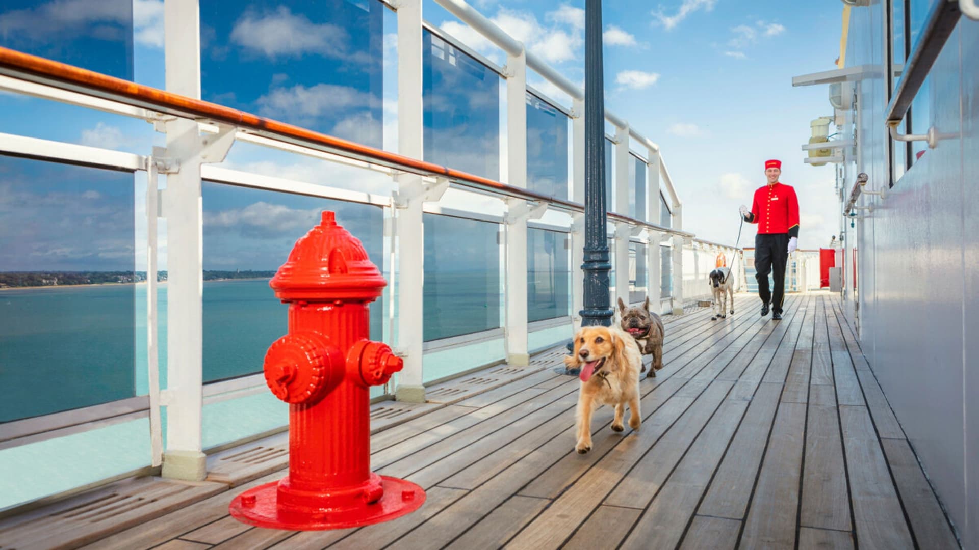 Master Kennel aboard Queen Mary 2 walking pets on the upper deck.