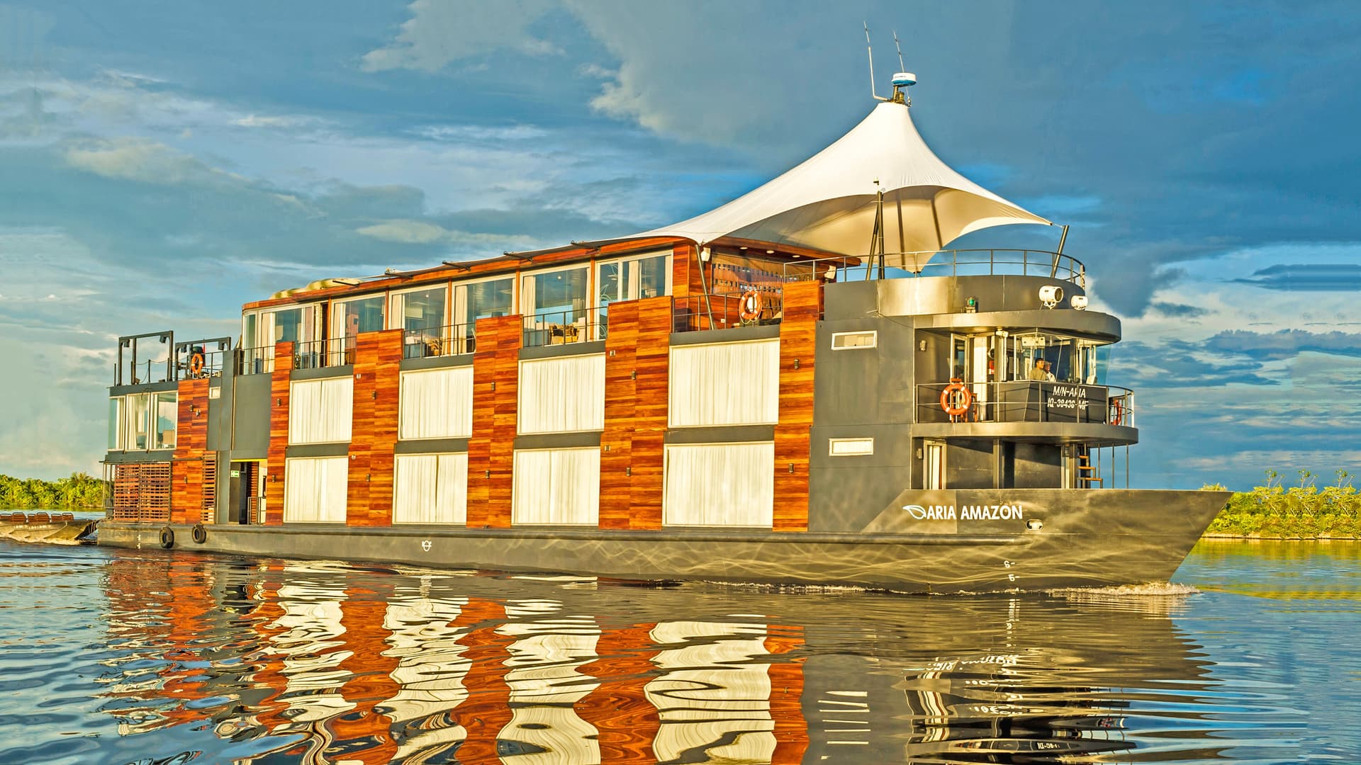 Uniworld's Aria Amazon ship sailing the Amazon.