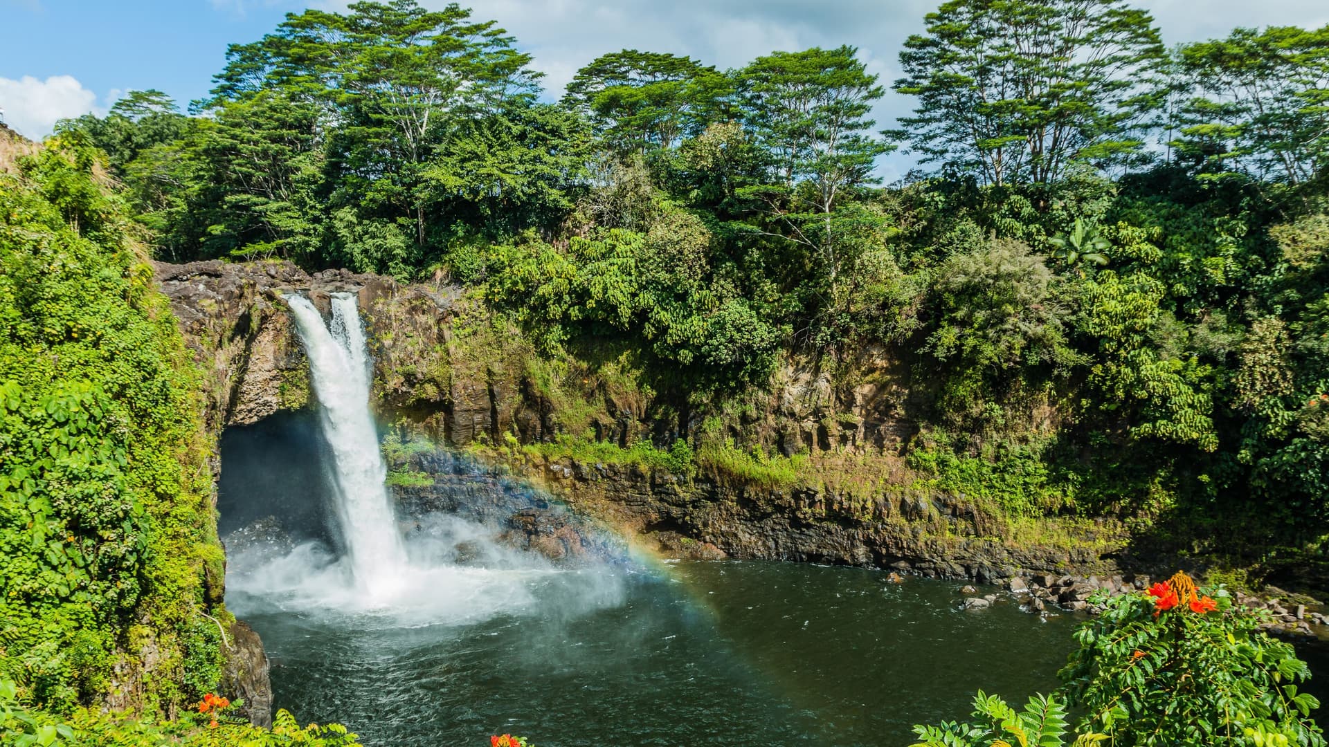 Waterfall and rainbow in Hilo, Hawaii.