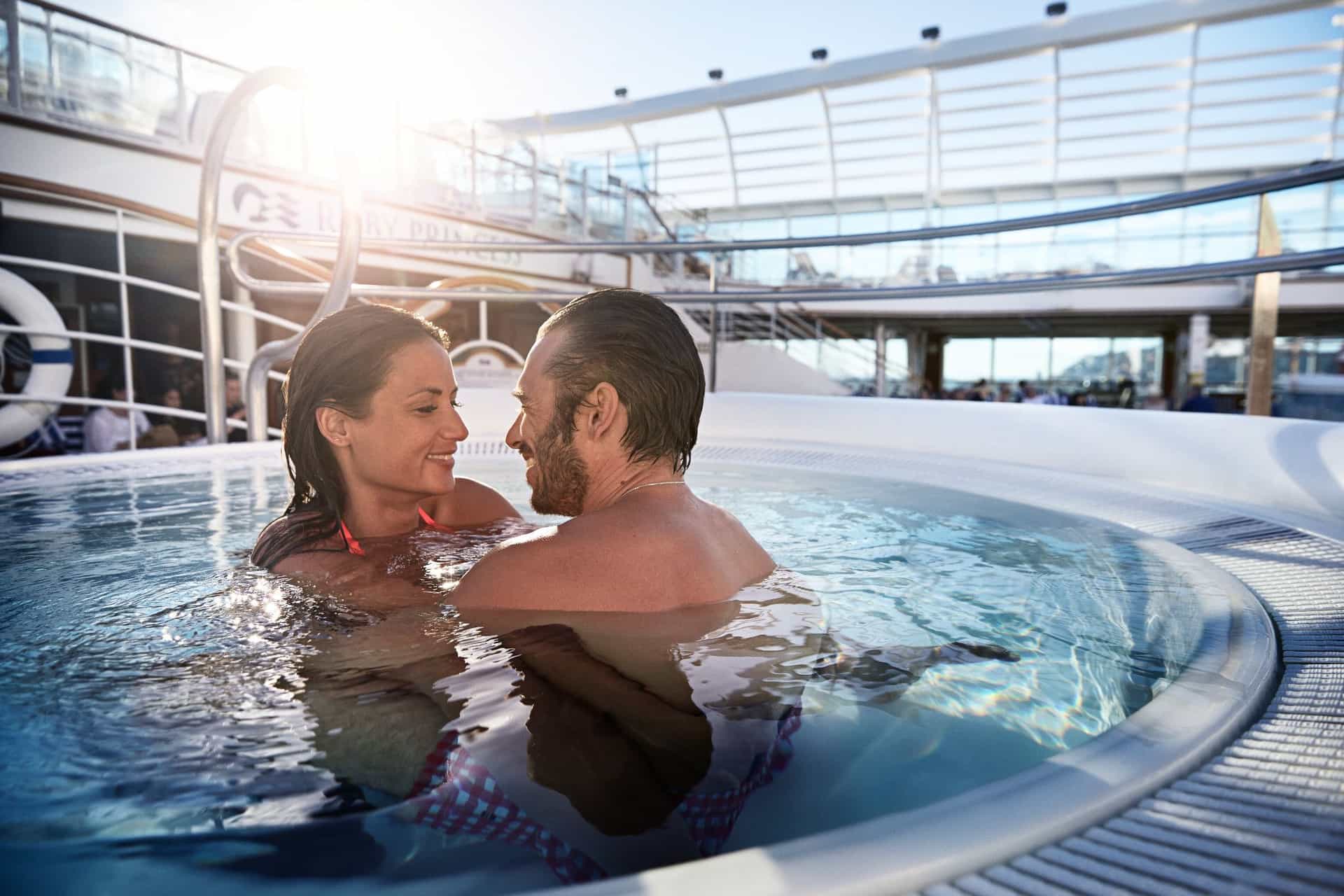 A couple enjoying the pool on a Princess cruise ship.