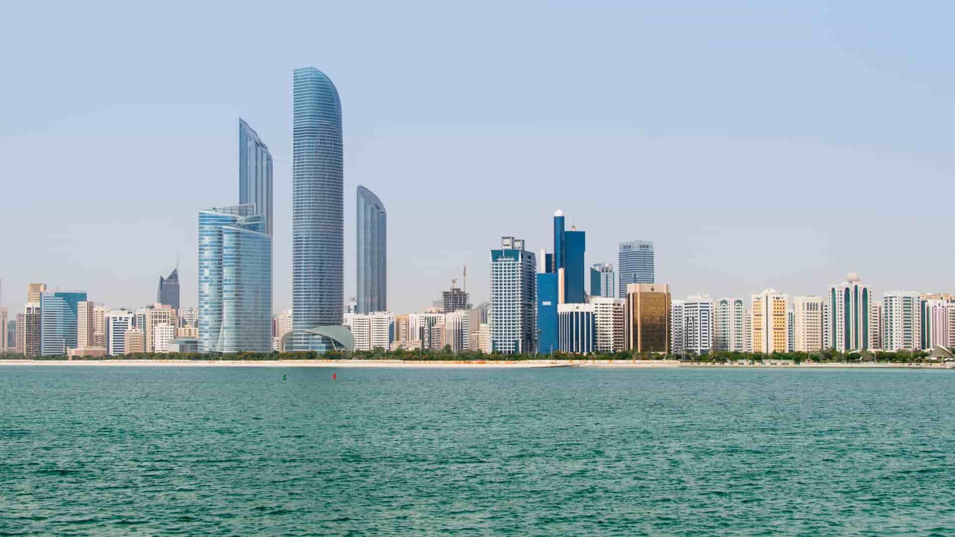 Abu Dhabi skyline featuring modern skyscrapers.