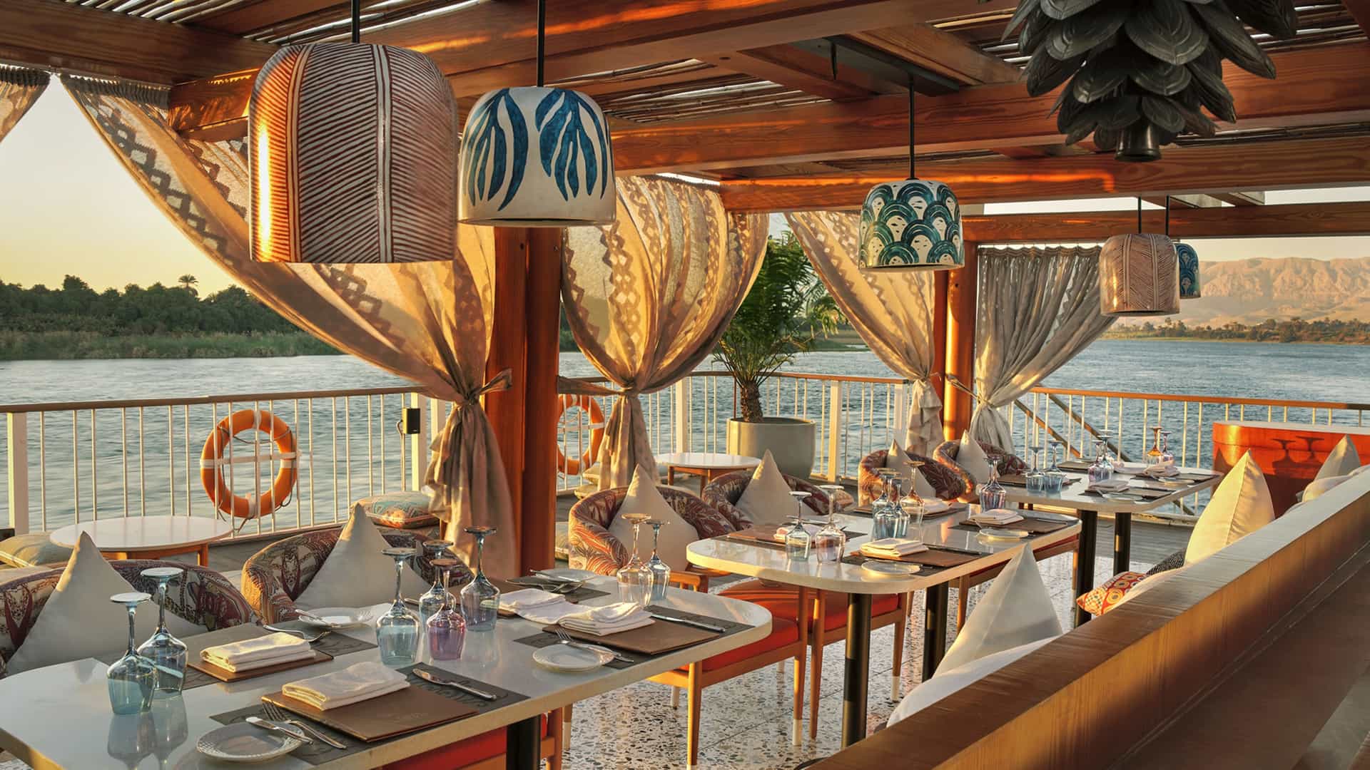 AmaWaterways AmaDahlia Chef's Al Fresco Restaurant with Nile River views at sunset.