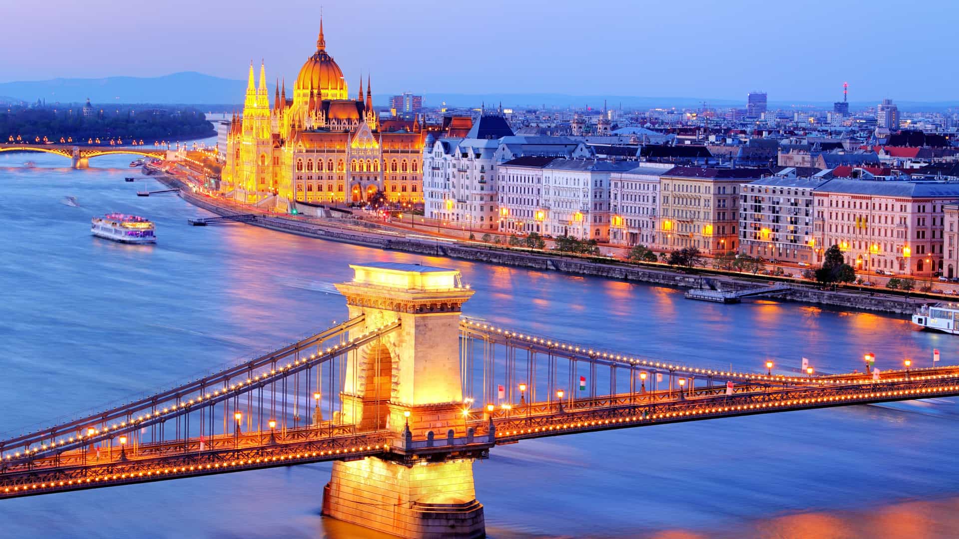 Budapest’s Parliament Building and Chain Bridge illuminated along the Danube River, a highlight of AmaWaterways Europe cruises.