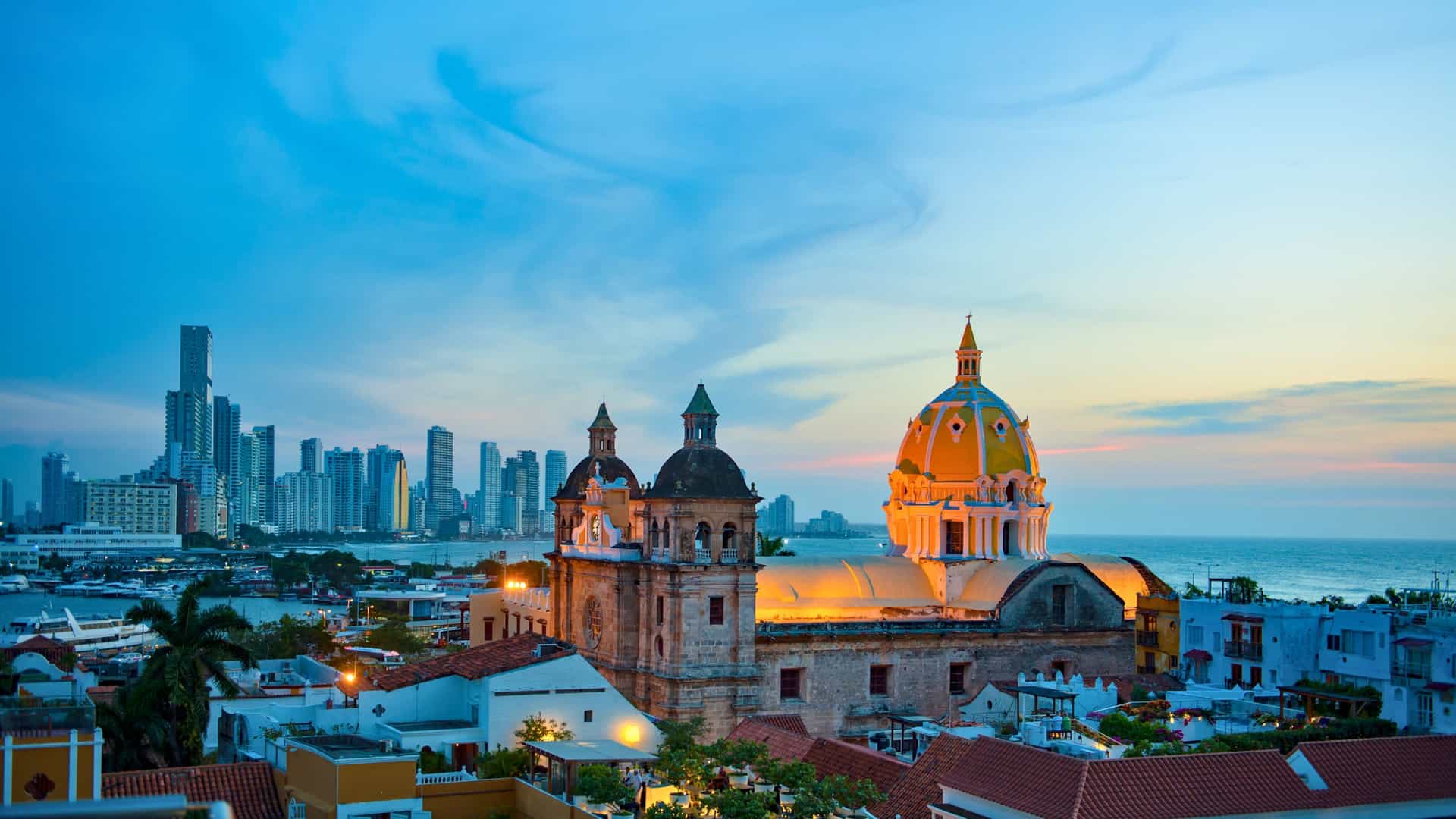 Vibrant colonial buildings and historic city walls in Cartagena, Colombia, a captivating port of call in South America on AmaWaterways' Magdalena River cruises, showcasing the rich culture and colorful architecture.