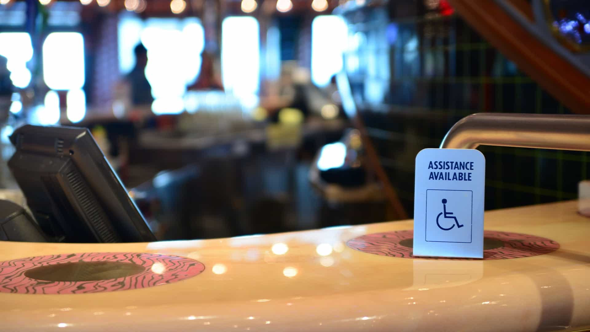 Assistance available wheelchair sign onboard a cruise ship.