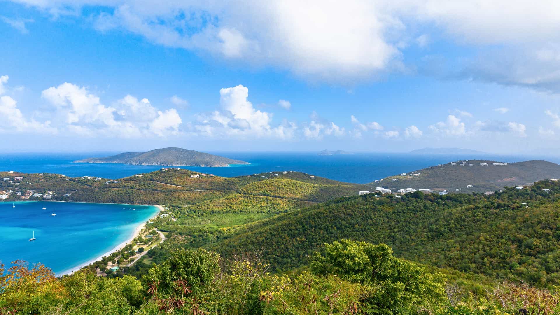 Azamara Cruises: Charlotte Amalie, St. Thomas - panoramic Eastern Caribbean port with bay, beach, and hills.