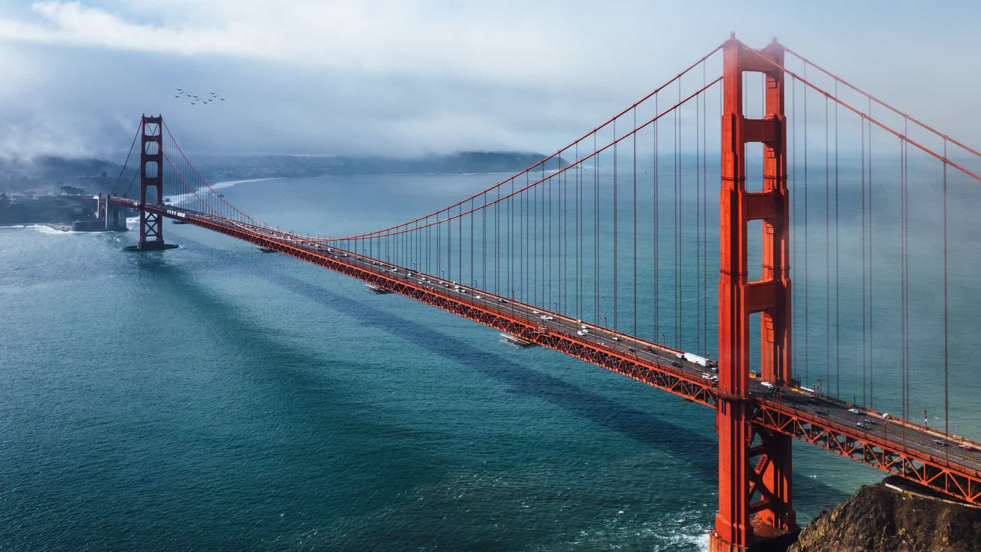 Golden Gate Bridge over San Francisco Bay with misty waters on a Celebrity Cruises US Pacific Coast voyage.