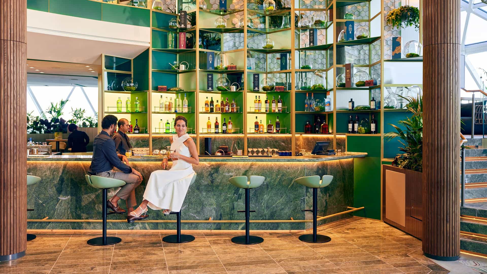 Couple sitting at the bar at the Eden on Celebrity Edge.