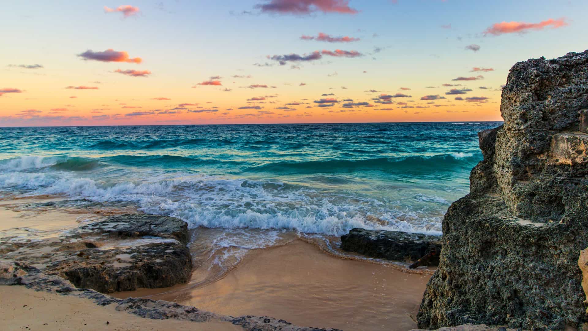 Deep Bay Beach, Hamilton, Bermuda: An aerial view of luxury resorts, embodying the Cunard cruise experience.
