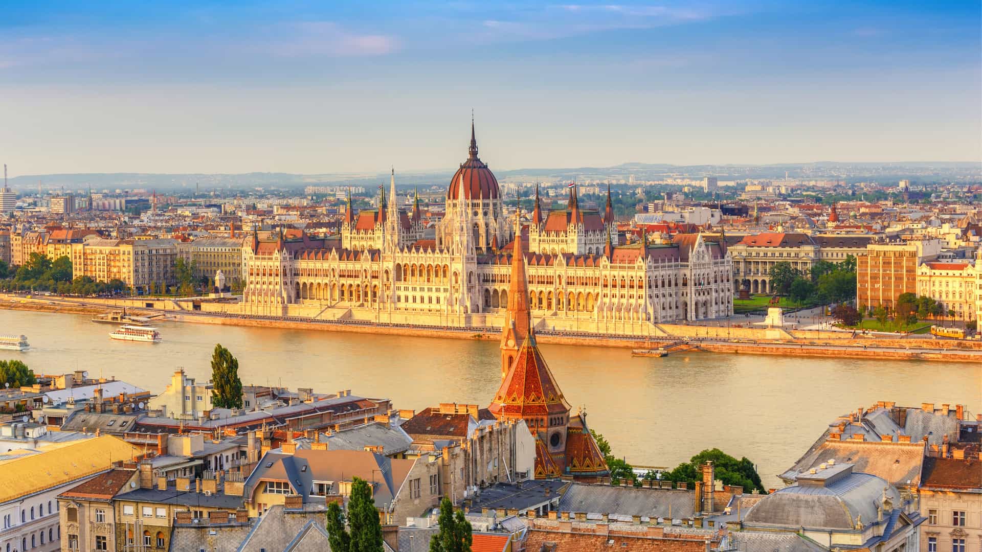 Budapest Parliament Building, a landmark in Hungary, stands majestically along the Danube River.