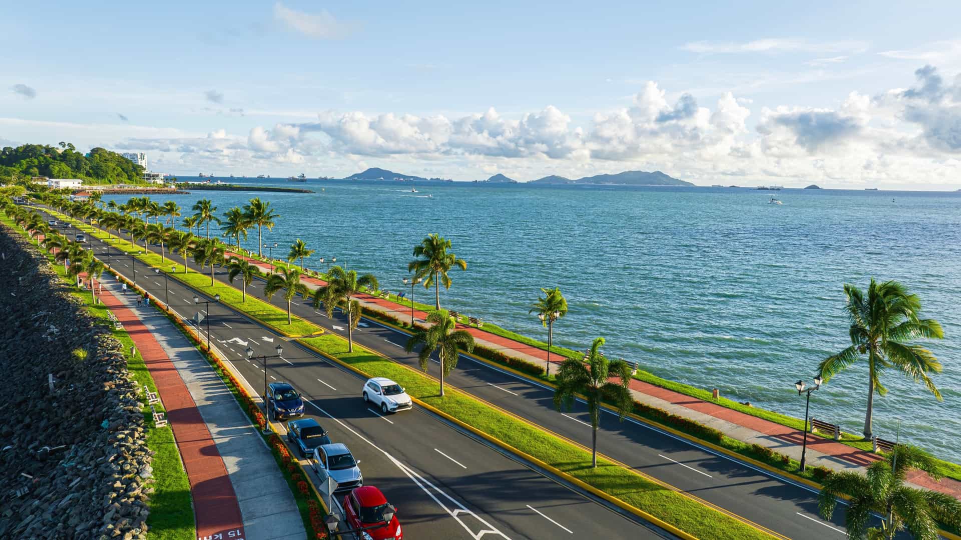 An aerial view of the Amador Causeway (Calzada de Amador) in Panama City, Panama, showing the road connecting the mainland to four small islands and the large marina.