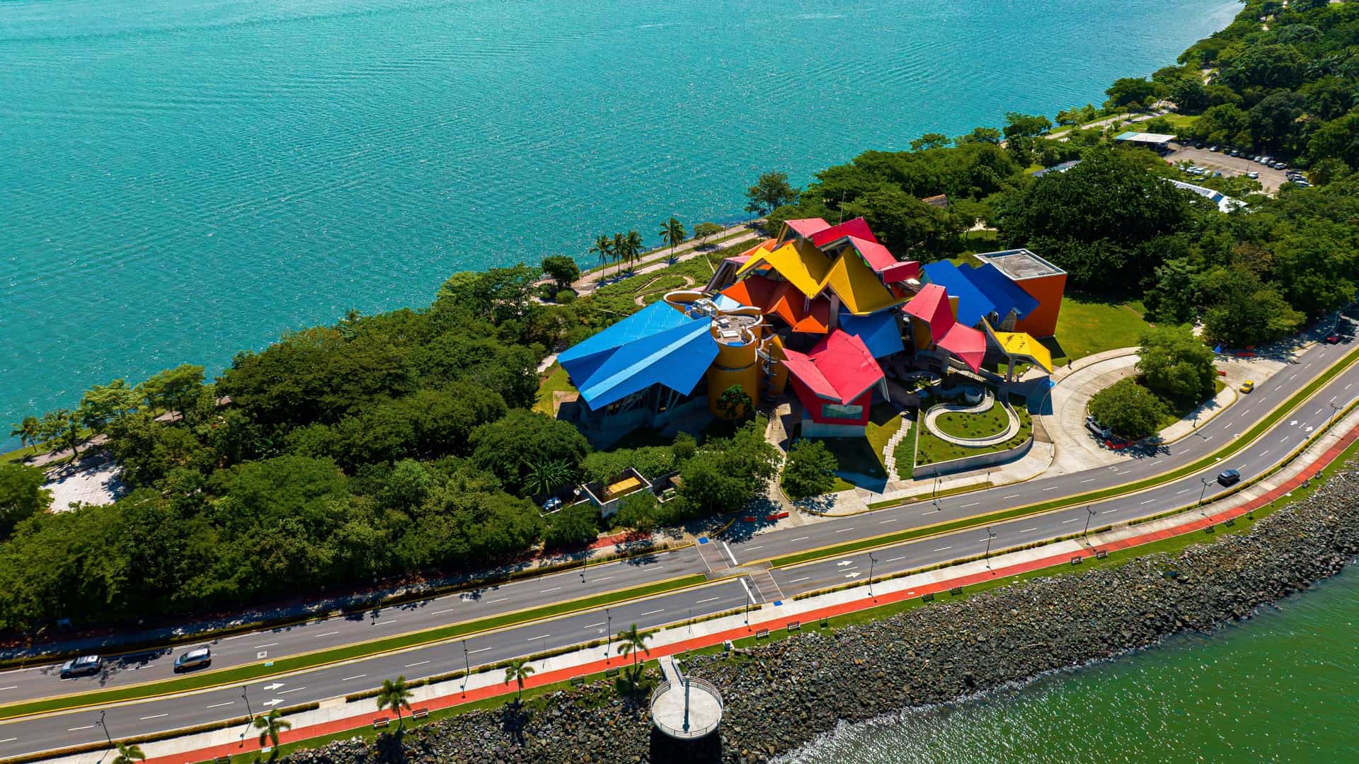 An aerial view of the Biomuseo in Panama City, Panama, showcasing the museum's distinct, brightly colored, deconstructivist architecture designed by Frank Gehry.