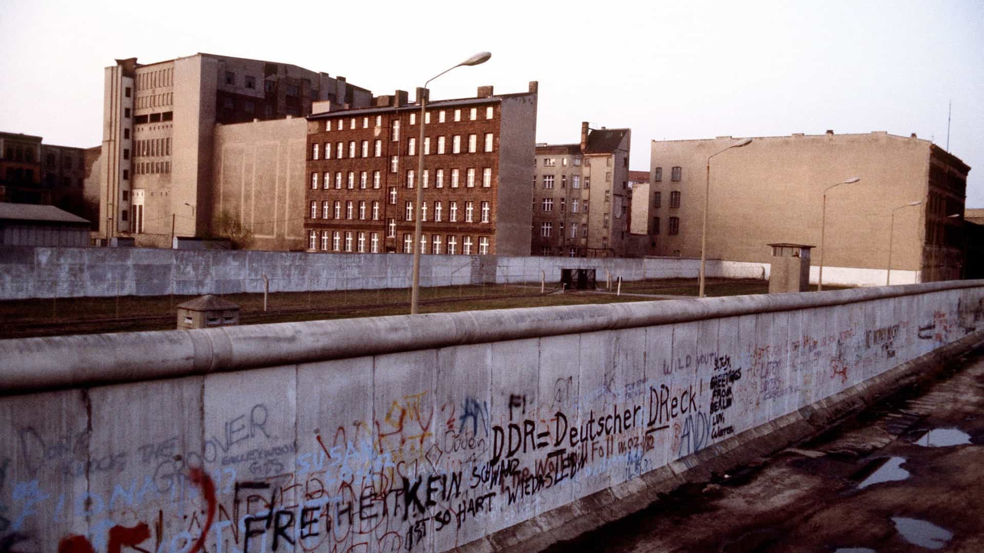 A section of the former Berlin Wall that separated communist-controlled East Germany and West Germany, showing its concrete structure and the open "death strip."