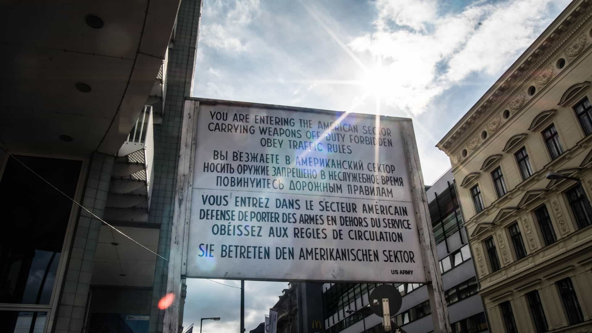 The reconstructed sentry box and sign at Checkpoint Charlie in Berlin, Germany, marking the famous former border crossing between East and West Berlin.